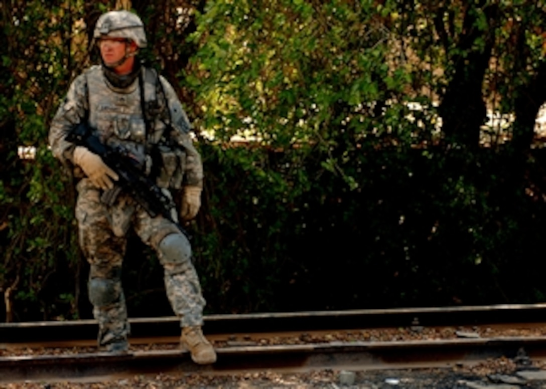 U.S. Army Staff Sgt. Brett Ehrhardt conducts a patrol in the Abu Dashir neighborhood of Baghdad, Iraq, on Aug. 14, 2008.  Ehrhardt is with 2nd Platoon, Delta Company, 2nd Battalion, 4th Infantry Regiment, 4th Brigade Combat Team, 10th Mountain Division.  