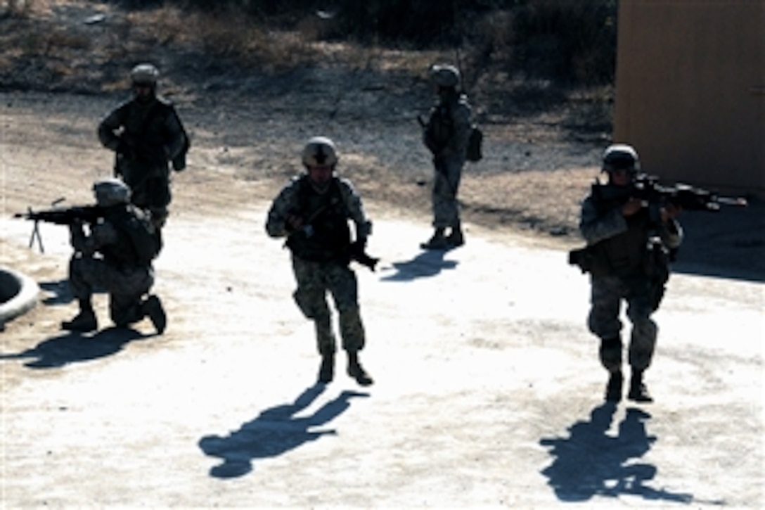U.S. Marines move from point to point during an urban warfare training session as part of an exercise in the simulated town on Camp Pendleton, Calif., Aug. 12, 2008. The Marines are assigned to the 1st Marine Division's 2nd Battalion.