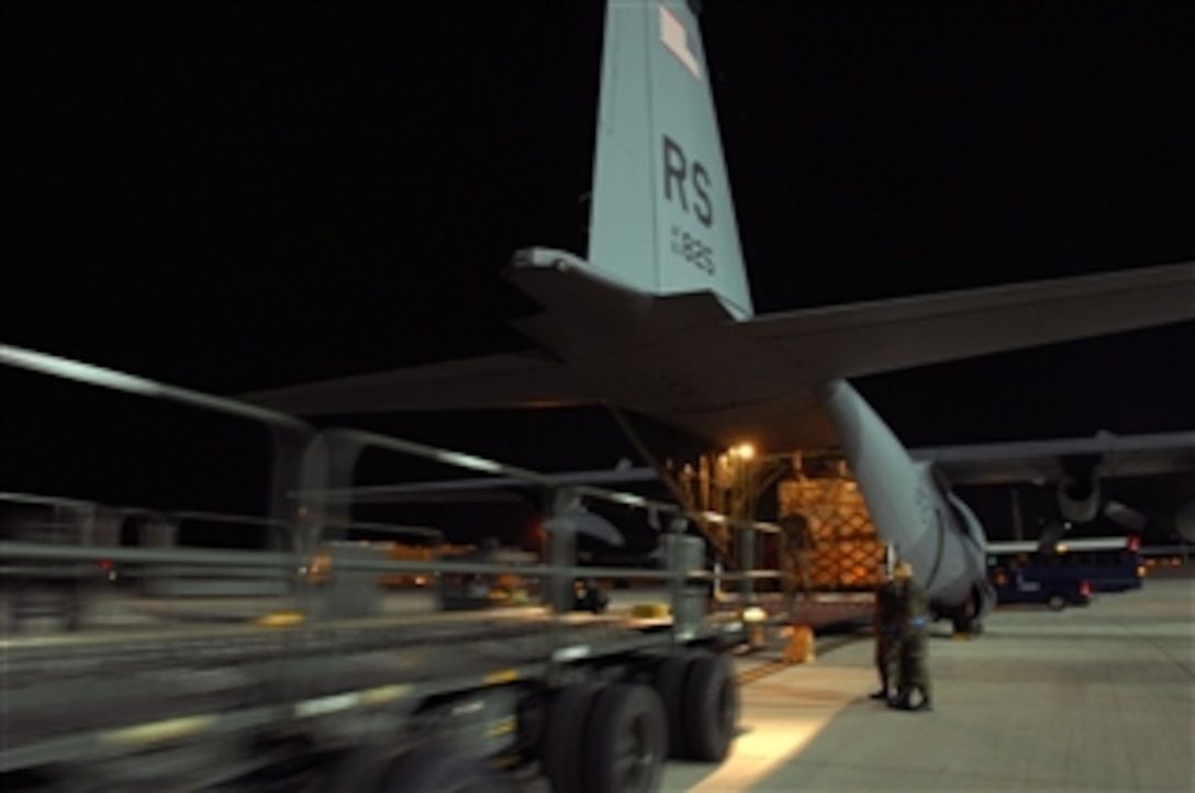 U.S. Air Force airmen load cargo onto a C-130 Hercules aircraft at Ramstein Air Base, Germany, on Aug. 14, 2008.  The pallets are humanitarian supplies being delivered to Georgian citizens.  U.S. airmen and soldiers worked 36 hours to palletize more than 75,000 pounds of emergency shelter items and medical supplies.  