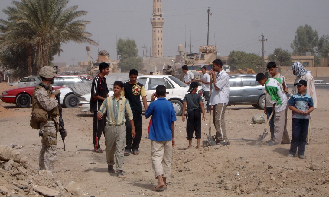 HABBANIYAH, Iraq (Aug. 21, 2008) – Citizens of Habbaniyah came together recently to improve a local clinic by constructing a drainage system, which will help with stagnate water that was collecting between the road and the Mudiq Clinic. The need for such a project was brought to the attention of Marines with Company C, 1st Battalion, 2nd Marine Regiment, Regimental Combat Team 1, during meetings with city council, community and Iraqi Police leaders. (Official U.S. Marine Corps photo by Lance Cpl. Scott Schmidt)