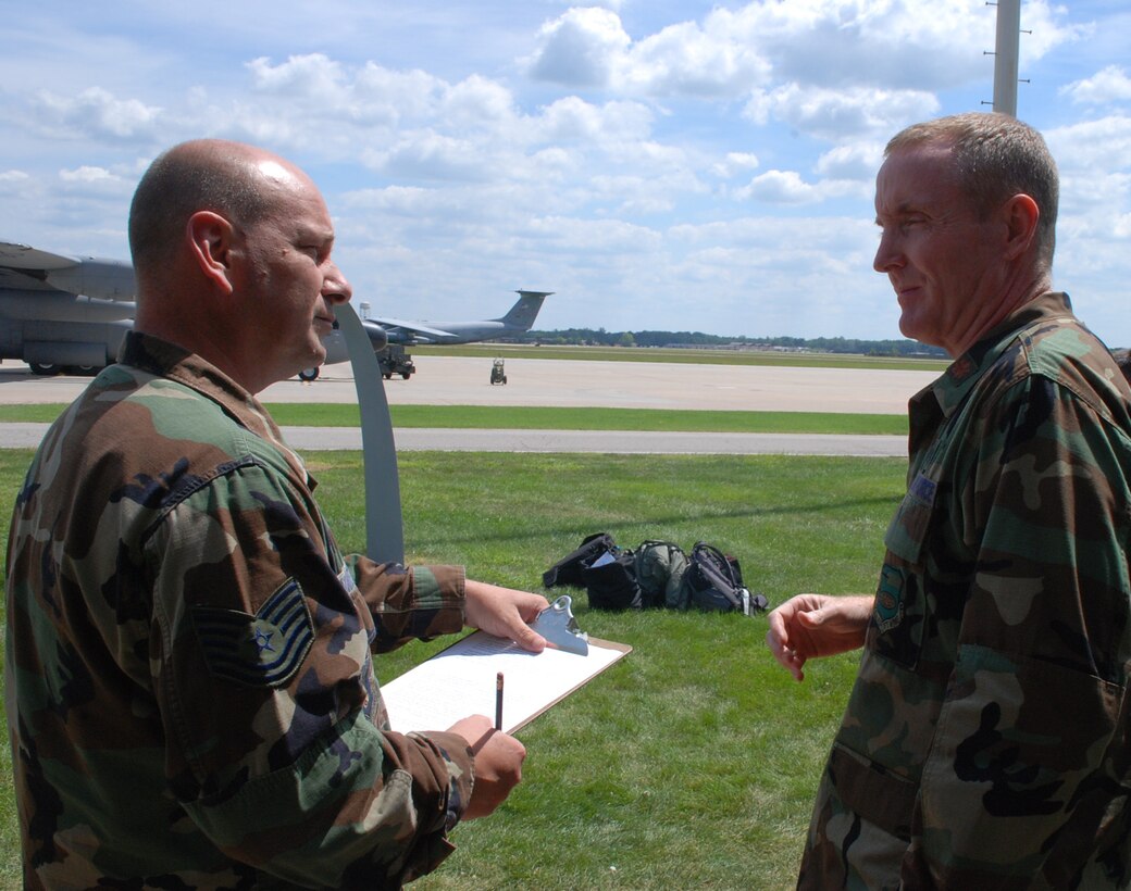 932nd Aeromedical Evacuation Squadron member and AE Jamboree 2008 coordinator Maj. Mike Nelson, talks with Gateway newspaper editor Tech. Sgt. Gerald Sonnenberg about the priorities for the event at Scott Air Force Base.  (U.S. Air Force Photo by Maj. Stan Paregien)
