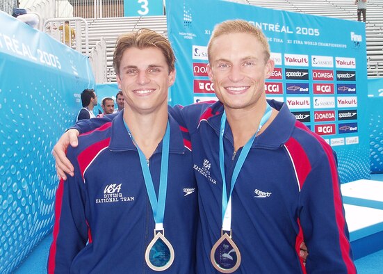 Capt. Justin Dumais (right), 157th Fighter Squadron F-16 pilot from McEntire Joint National Guard Base, S.C., stands with his brother, Troy, at the 2005 World Championships in Montreal. The brothers competed in the men’s three-meter synchronized diving event and earned a bronze medal. Dumais is an alternate competitor in the men's three-meter synchronized diving event for the U.S. 2012 Summer Games in London.  (courtesy photo)