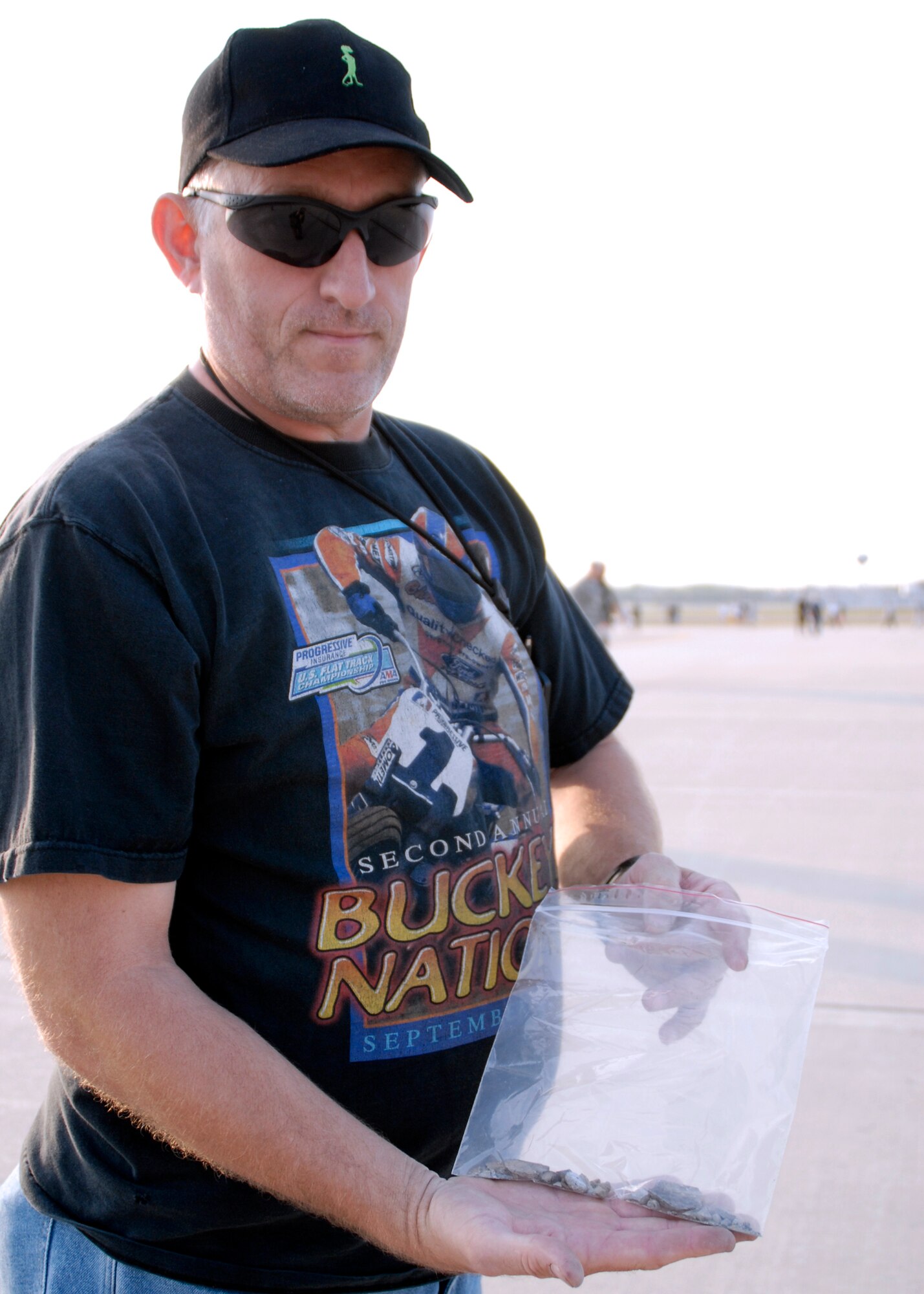 U.S. Air Force Tech. Sgt. Mike Heaton, 445th Aircraft Maintenance Squadron, holds a collection of Foreign Object Debris (FOD) during a FOD walk on the flightline located at Wright-Patterson Air Force Base, Ohio, on August 20, 2008. FOD walks are a good way of housekeeping around the aircraft, and policing the flightline area in search of possible foreign objects that could be ingested into engines potentially causing damage. (U.S. Air Force photo by Senior Airman Ken LaRock)   