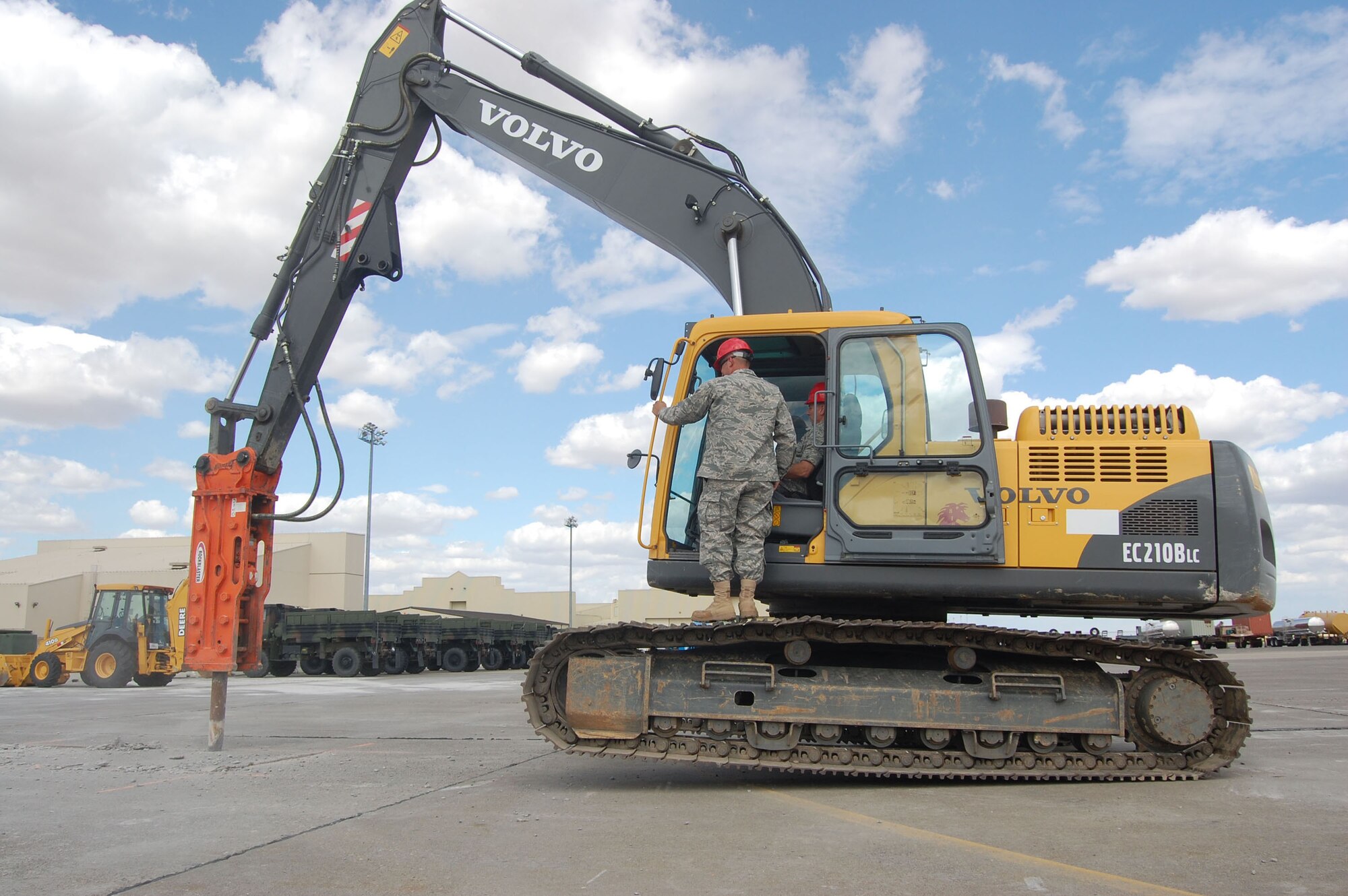 Maj. Gen. Floyd Carpenter, 8th Air Force vice commander, learns how to pulverize and tear up concrete in an excavator from Airman 1st Class Brandon Lynch, 819th RED HORSE Squadron, during a ground breaking ceremony at Malmstrom Air Force Base, Mont., Aug. 14. The 819th RHS is tearing up a 20,000 square foot area to build a unit assembly area; a $678,000 construction project slated to be completed by March 2009 and built entirely by the squadron. Lt. Gen. Robert Elder, 8th AF commander, and General Carpenter, both participated in the ground breaking ceremony. (U.S. Air Force photo/Senior Airman Eydie Sakura).  