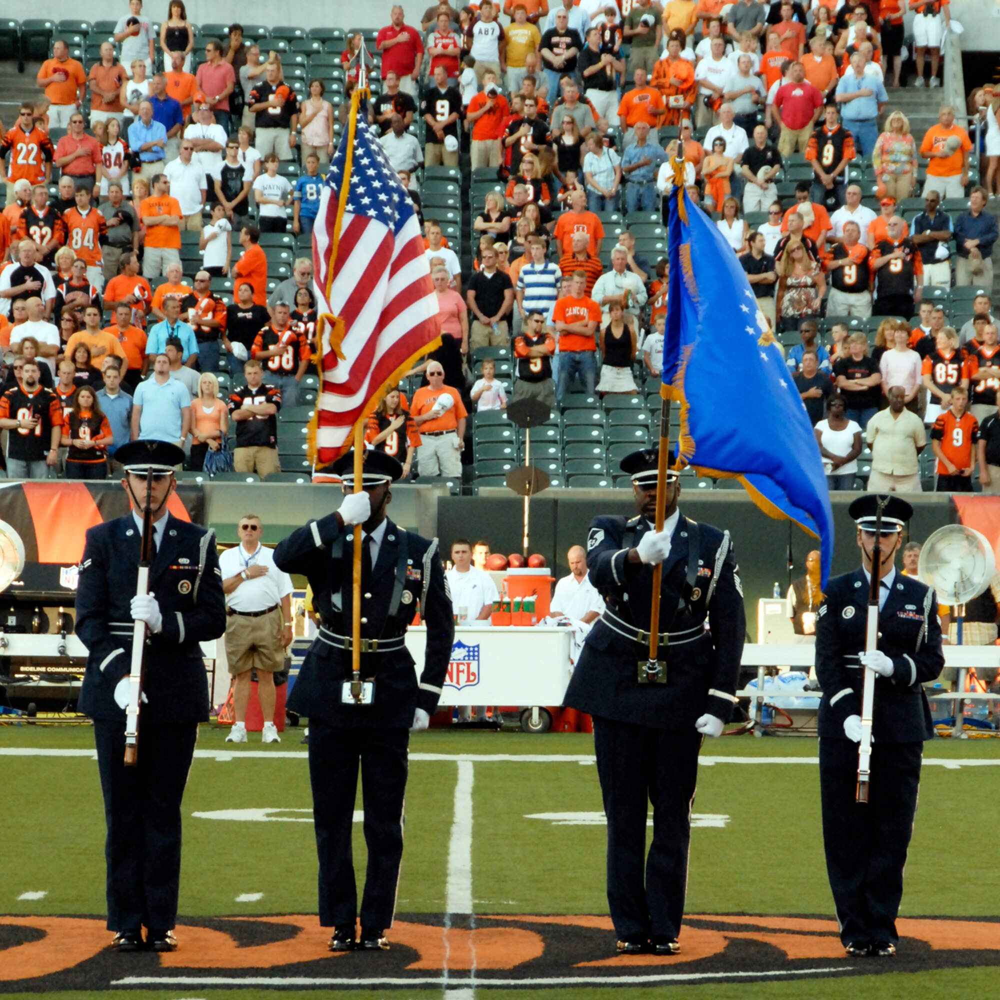 U.S. Air Force Airman 1st Class Brandon Mitchell, Master Sgt. Mark Lyle, Master Sgt. Michael Bailey, and Senior Airman Jeanice Smith post the colors for the opening ceremony at the Bengals vs. Lions football game at Paul Brown Stadium located in Cincinnati, Ohio, on August 17, 2008.  The Honor Guard is dedicated to supporting the ceremonial needs of the 445th Airlift Wing and the greater Miami Valley communities by proudly performing as professional representatives of the United States Air Force. (U.S. Air Force photo by Senior Airman Ken LaRock)