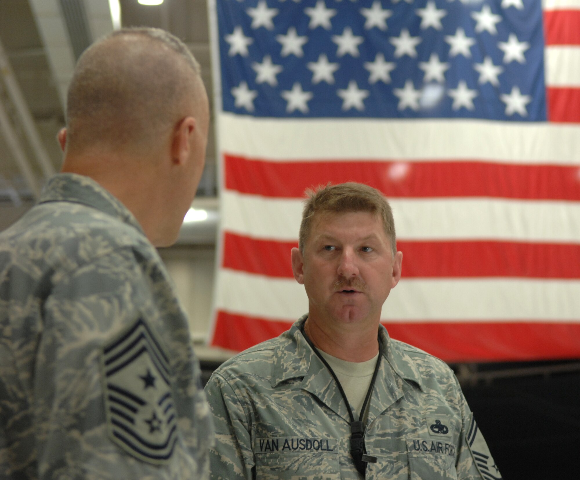 WHITEMAN AIR FORCE BASE, Mo. – Senior Master Sgt. Roscoe Van Ausdoll, 509th Maintenance Group, talks to Command Chief Master Sgt. Todd Kabalan, the 8th Air Force command chief master sergeant, Aug. 15. In addition to seeing the mission first hand, Chief Kabalan interacted with the Airmen of Whiteman and re-emphasized the 8th Air Force commander’s message and priorities during his visit Aug. 14-17. (U.S. Air Force photo/Airman 1st Class Stephen Linch)

