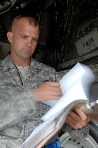 BARKSDALE AIR FORCE BASE, La. - Tech Sgt. Robert Taylor performs and quality check of the aircraft discrepancy log during a Nuclear Operational Readiness Exercise held here Aug 19. Strategic weapons readiness is key to deter opponents and bolster ally confidence to win today's fight. (U.S. Air Force photo by Airman 1st Class Joanna M. Kresge)