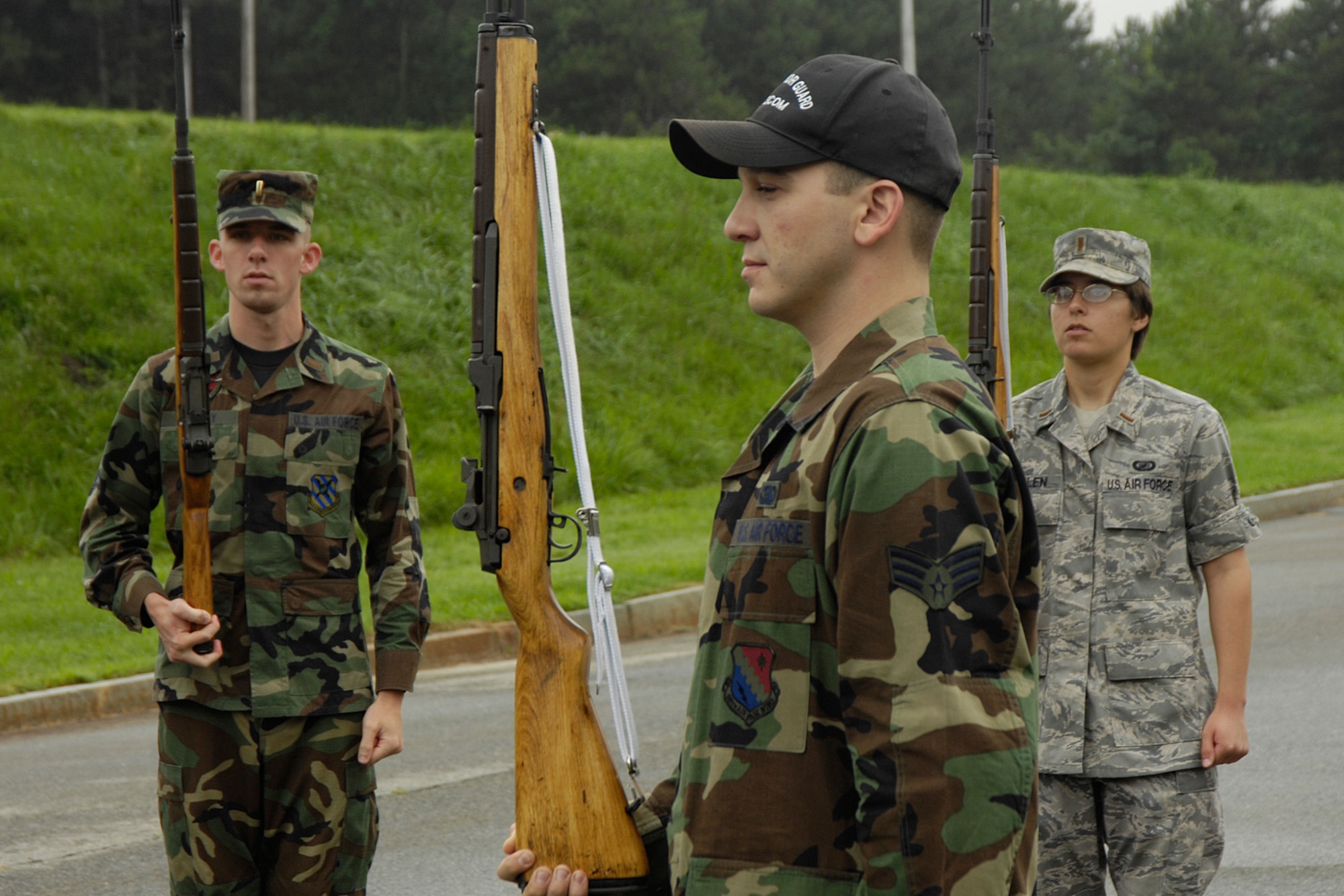 HANSCOM AFB, Mass. – Second Lieutenant Jared Grady (left), 350th Electronic Systems Wing, and 2nd Lt. Rebekah Guillen (right) of the 46th Test Squadron receive honor guard training recently from Senior Airman Jesse Dunn (center), 66th Services Squadron, Patriot Honor Guard member. To volunteer to become a member of the honor guard team or for more information, call (781) 377-4850. (U.S. Air Force photo by Linda LaBonte Britt)