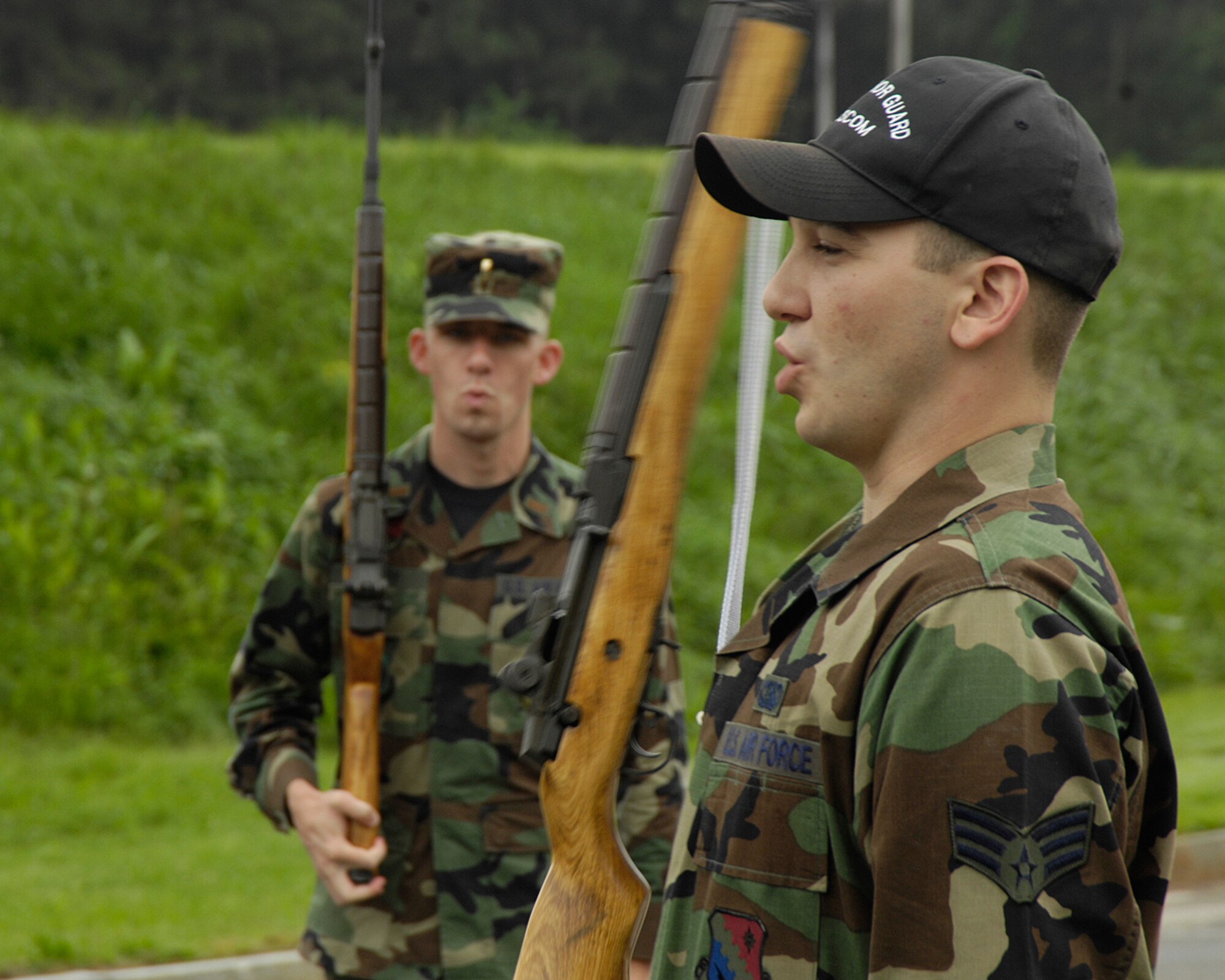 HANSCOM AFB, Mass. – Senior Airman Jesse Dunn (right), Patriot Honor Guard member, calls out commands during a recent training session for honor guard team members. The Patriot Honor Guard participates in a variety of events including promotions, retirement ceremonies, large sports events and military funeral honors. (U.S. Air Force photo by Linda LaBonte Britt)