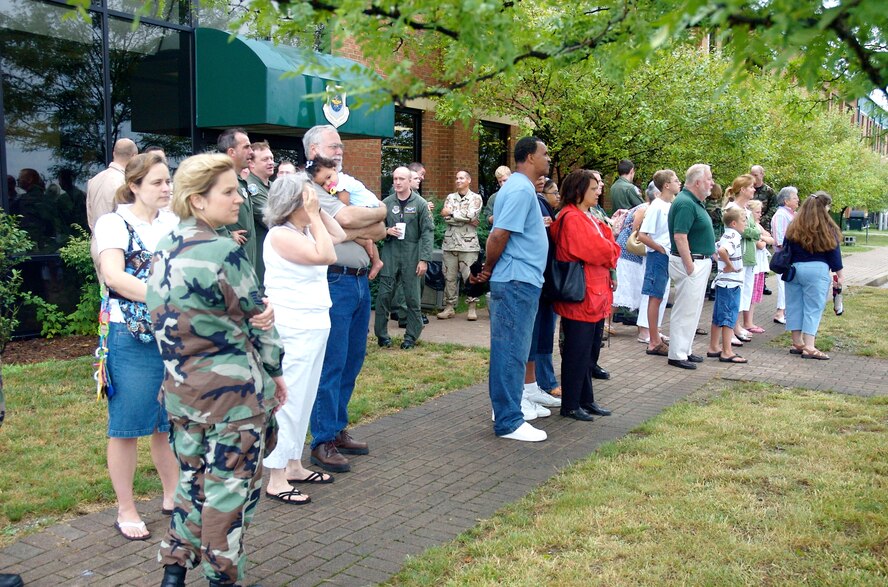 Coworkers and family members gather at the Kentucky Air National Guard Base July 5 to bid farewell to 34 Airmen who are deploying to Baghram Air Base, Afghanistan.
(Capt. Dale Greer/KyANG)