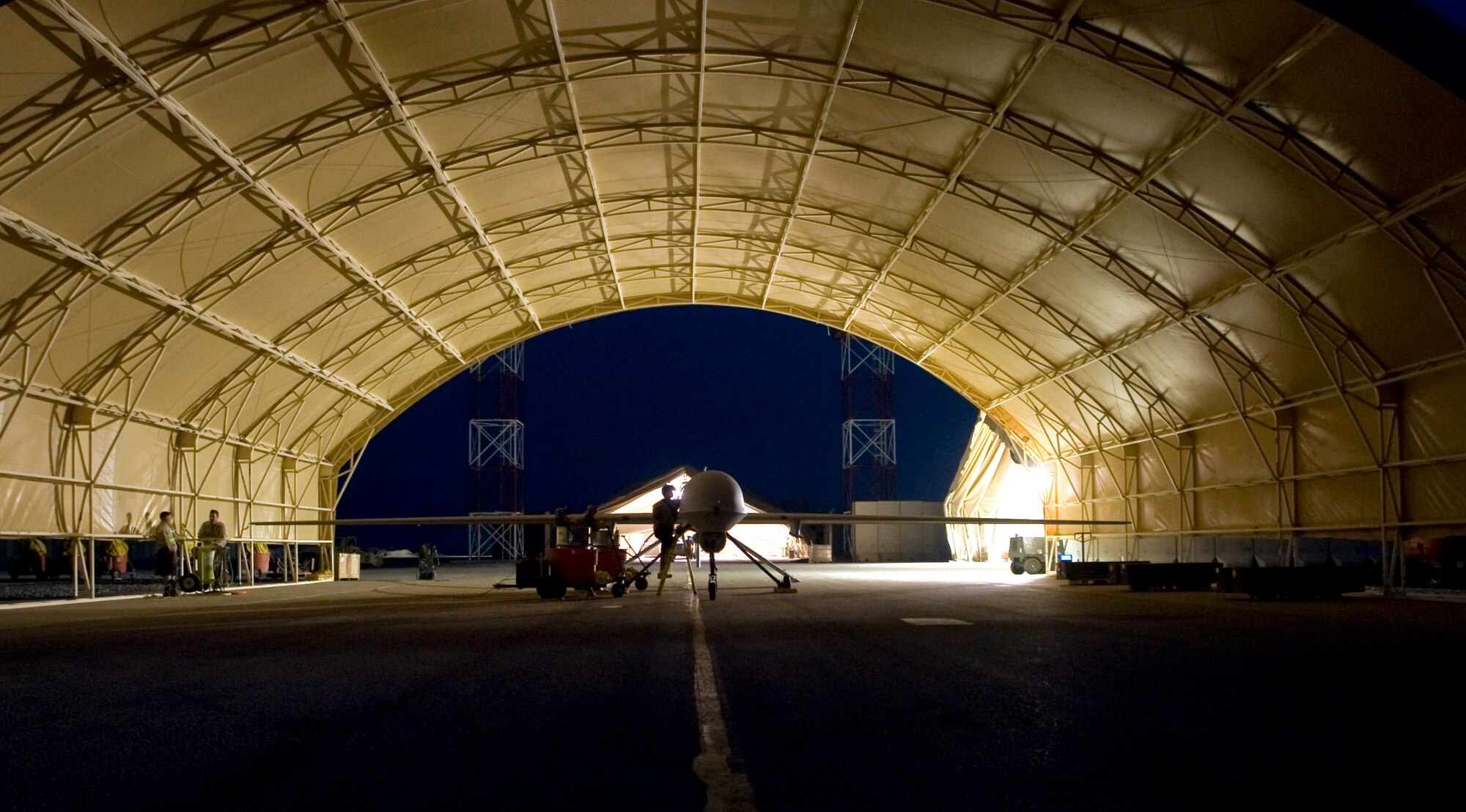 An MQ-1 Predator goes through post-flight maintenance Aug. 11 at Ali Base, Iraq. The Predator provides integrated and synchronized close-air combat operations, including intelligence, surveillance and reconnaissance, to ground commanders. The Predator is assigned to the 46th Expeditionary Reconnaissance and Attack Squadron Det. 1 here. (U.S. Air Force photo/Airman 1st Class Christopher Griffin) 
