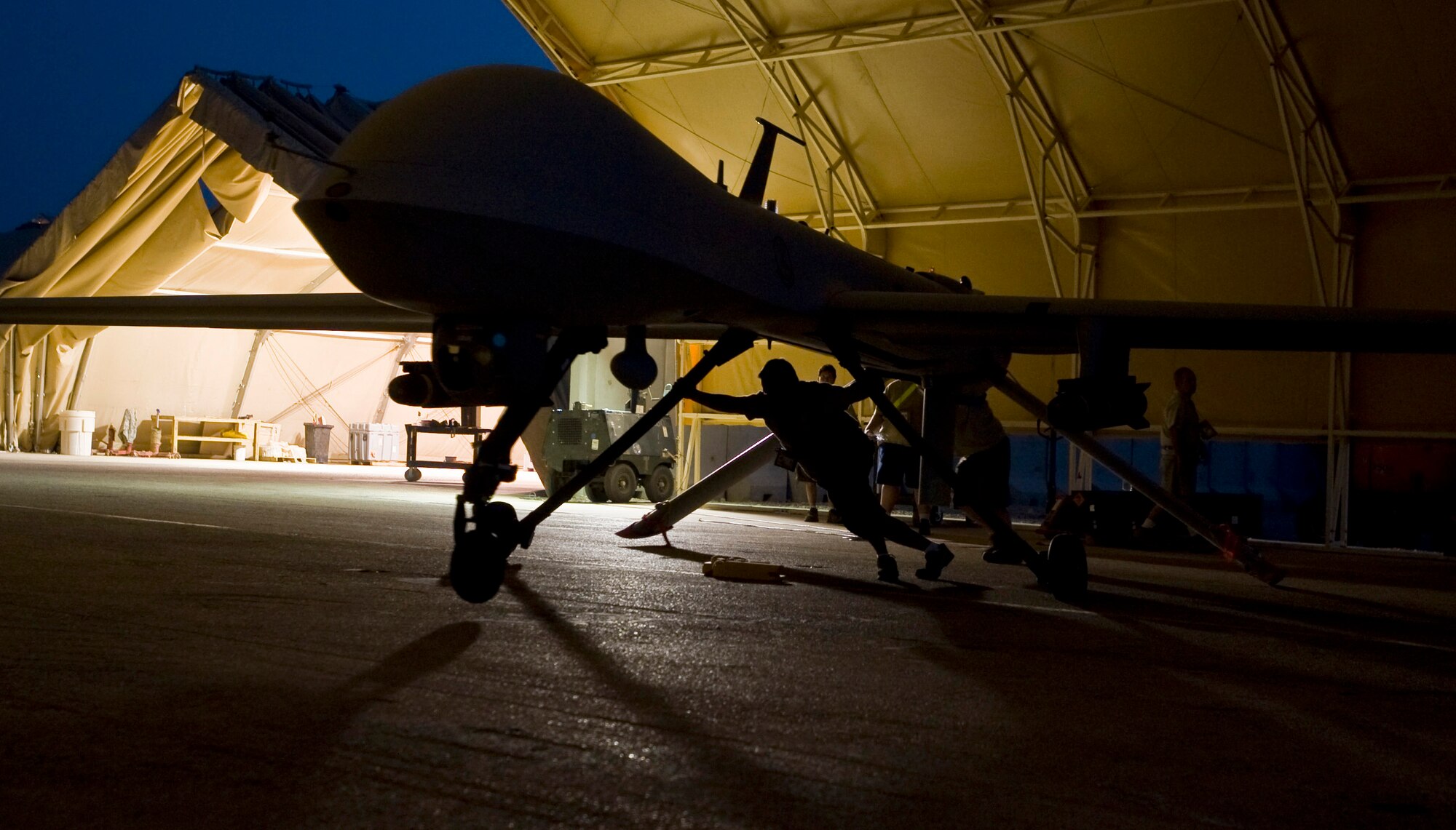 An MQ-1 Predator goes through post-flight maintenance Aug. 11 at Ali Base, Iraq. The Predator provides integrated and synchronized close-air combat operations, including intelligence, surveillance and reconnaissance, to ground commanders. The Predator is assigned to the 46th Expeditionary Reconnaissance and Attack Squadron Det. 1 here. (U.S. Air Force photo/Airman 1st Class Christopher Griffin) 

