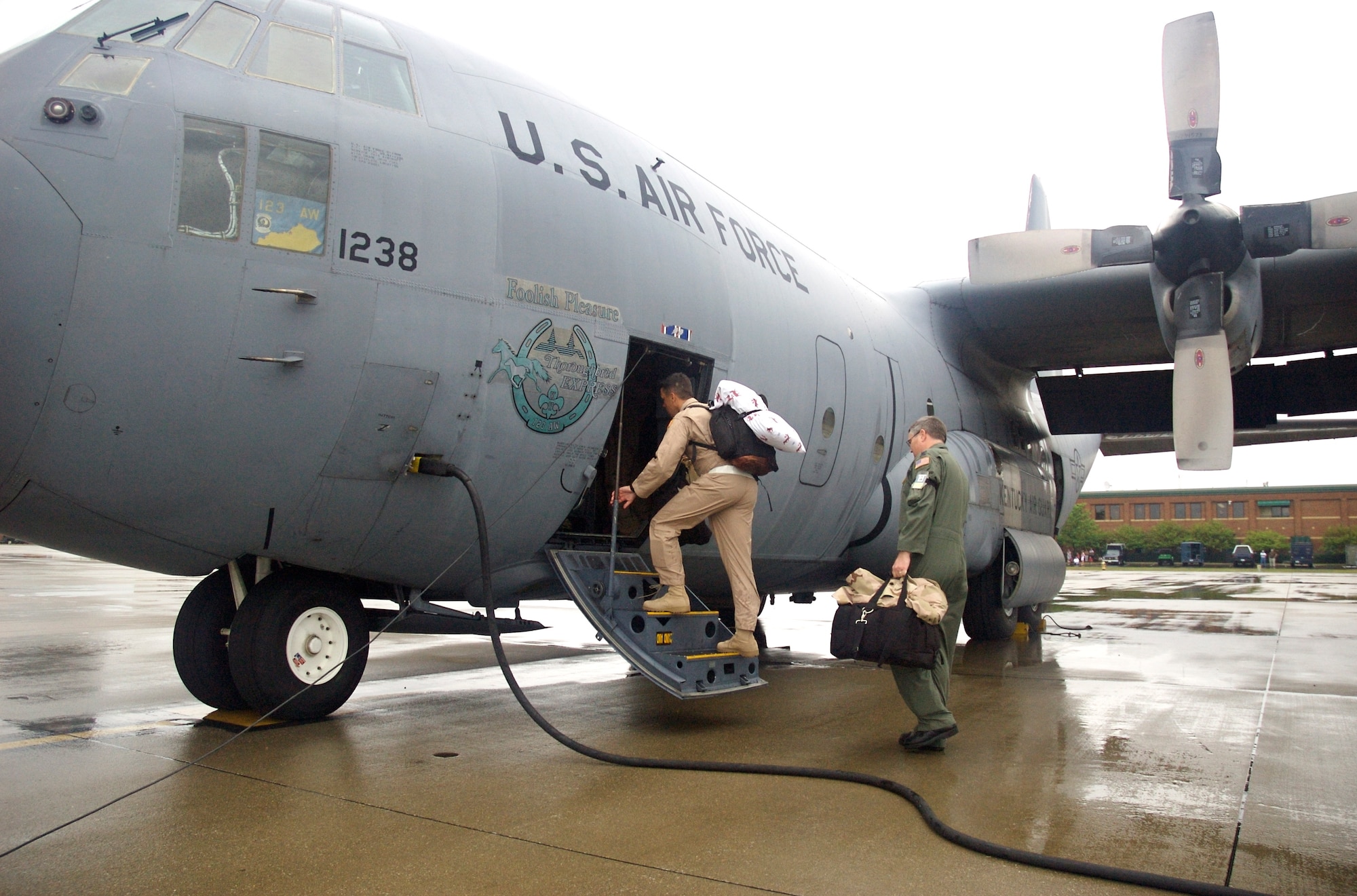 Members of the 123rd Airlift Wing deploy from the Kentucky Air Guard flightline for
Baghram Air Base, Afghanistan, on July 5.

The Airmen will provide airlift services in the Central Command Area of Responsibility
as part of Operation Enduring Freedom and the Global War on Terror.

More than 210 Kentucky Air Guardsmen and multiple C-130 aircraft are expected to
deploy in support of the mission through September 10.

(Capt. Dale Greer/KyANG)