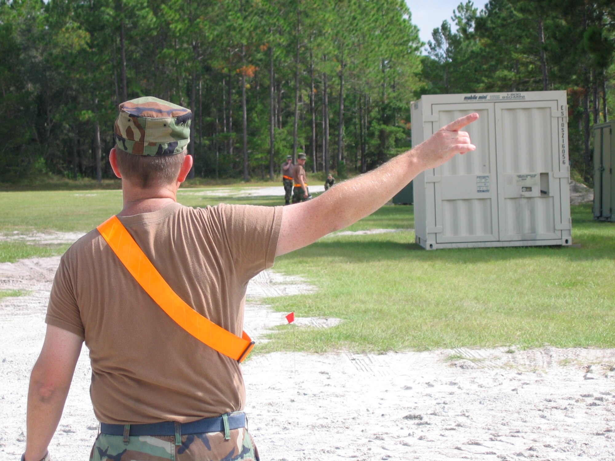 Master Sgt. Kevin Kaufman of the 123rd Civil Engineering Squadron surveys land
for the construction of a tent city. (Photo courtesy 123rd Civil Engineering Squadron)
