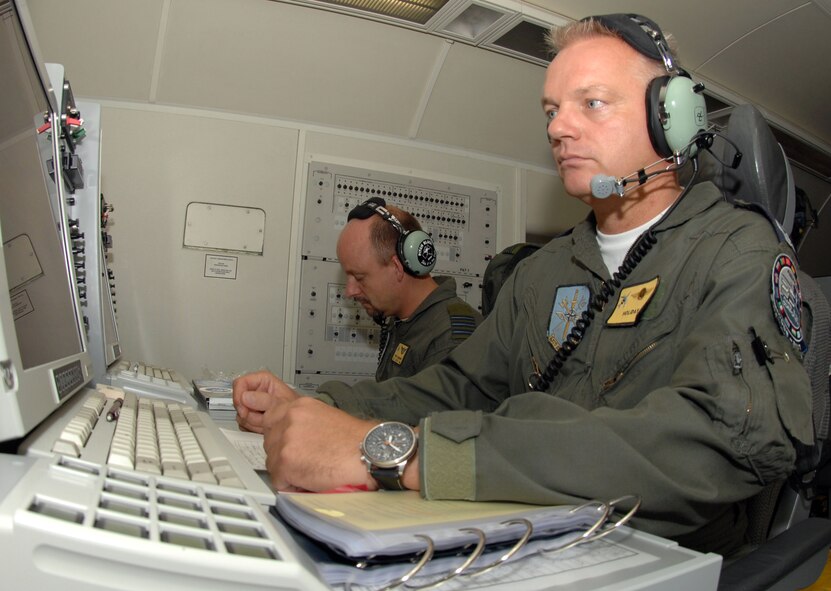German officer Lt. Col Raimond Schulz and Danish officer Maj. Peter Boersting, tactical directors, examine their radars during a training exercise on board a E-3ANMT aircraft(AWAC) from Geilenkirchen North Atlantic Treaty Organization(NATO) Air Base, Germany August 15, 2008 on Seymour Johnson Air Force Base, North Carolina. On this aircraft there are Air Force members from Turkey, Portugal, United States, Denmark, Germany, Greece, and Canada. (U.S. Air Force photo by Airman 1st Class Gino Reyes)