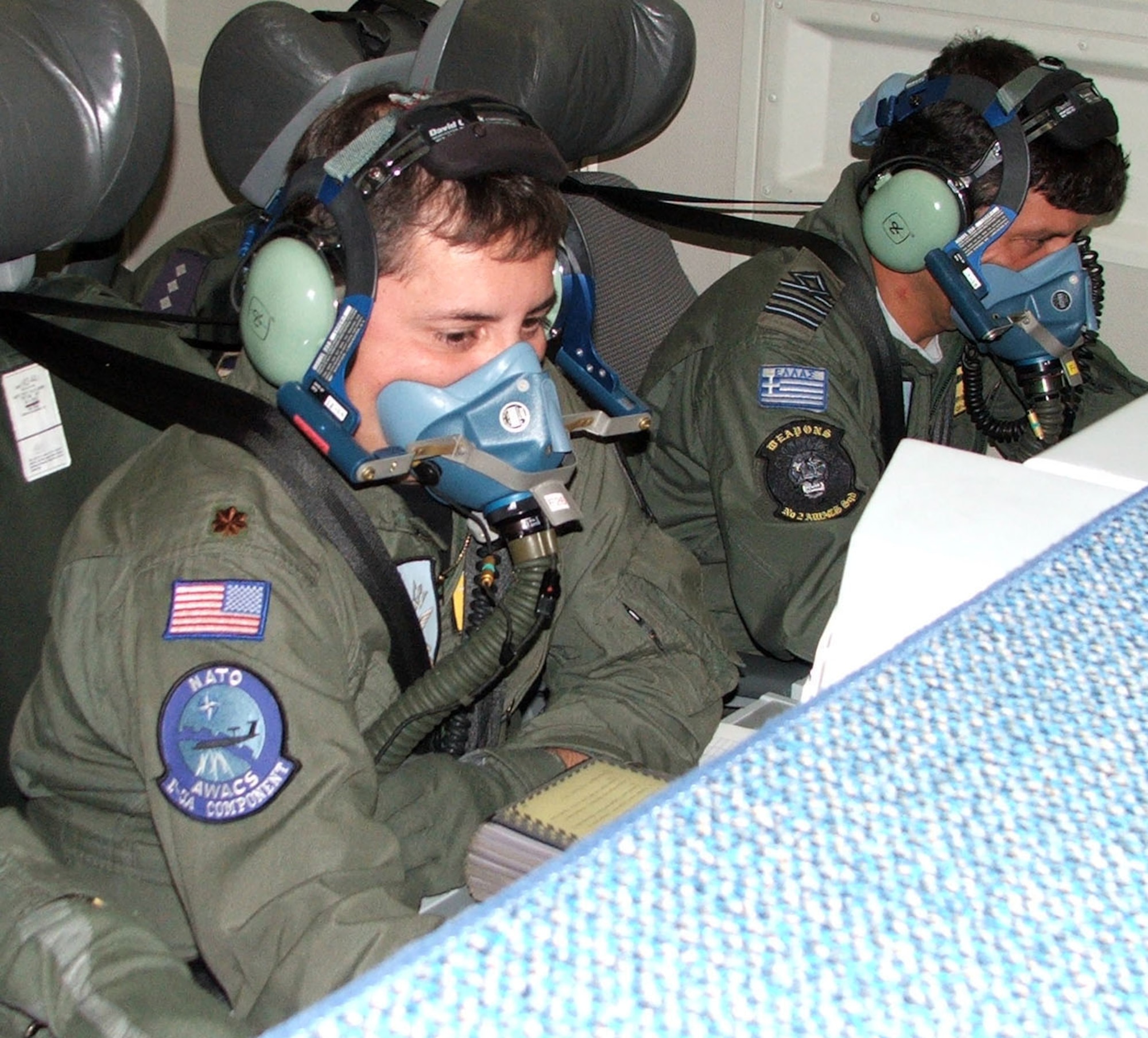 Major Sean Spradlin and Maj. Ioannis Tsakiris, crew members, examine their radars that let pilots know where enemy aircraft are positioned on board a E-3ANMT aircraft(AWAC) from Geilenkirchen North Atlantic Treaty Organization Air Base, Germany on  Aug 15, 2008 on Seymour Johnson Air force Base. On this aircraft there were Air Force members from Turkey, Portugal, United States, Denmark, Germany, Greece, and Canada.(U.S. Air Force photo by Airman 1st Class Gino Reyes)