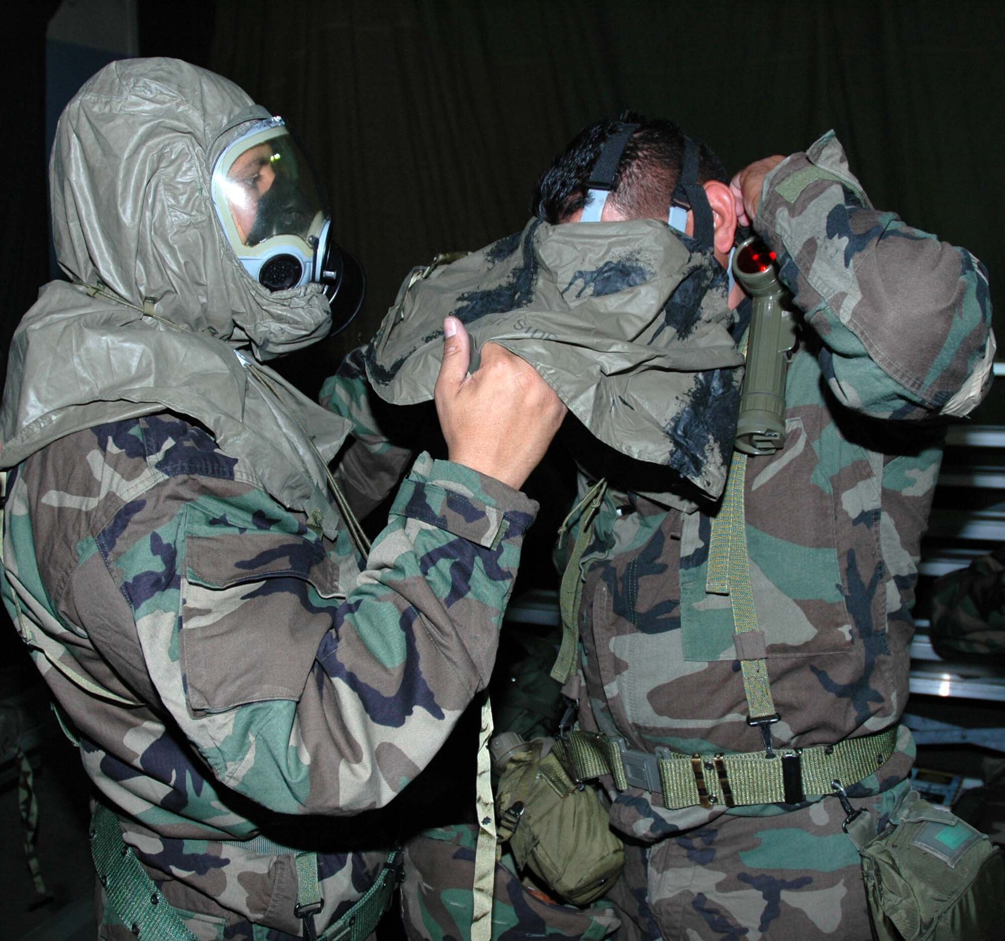 MCGUIRE AIR FORCE BASE, N.J. -- Reserve civil engineering members Tech. Sgt. Javier Diaz and Staff Sgt. John Melecio, use the "Buddy System" during a recent Battle Axe training session. Battle Axe is a half day course designed to reinforce ability to survive and operate skills in a war environment. Preparation for the upcoming Operational Readiness Inspection includes sending participants through the Battle Axe training facility.  (U.S. Air Force photo/Master Sgt. Charles W. Kramer) 