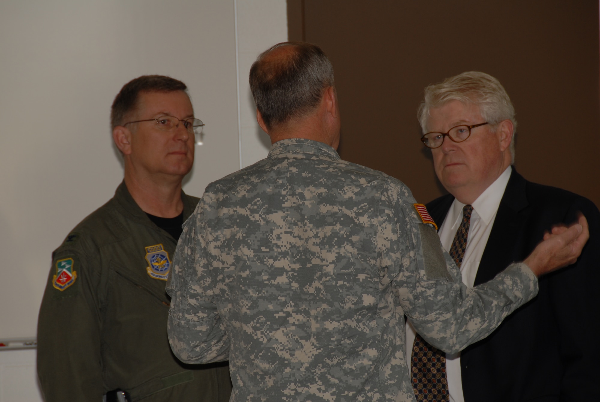 Adjutant General of Ohio Joint Force Headquarters Major General Gregory L. Wayt speaks with Colonel Mark L. Stephens, 179th Airlift Wing Commander (left) and base supporter Mike Green at the ribbon cutting ceremony for the new Army Guard Fire Station at Mansfield Lahm Airport, Mansfield, Ohio on May 30, 2008. The occasion marked the first Army Guard installation at the Mansfield Lahm Guard Base which has only been an Air National Guard base since opening in 1948. (U.S Air Force photo by A1C Joseph Harwood) (Released)