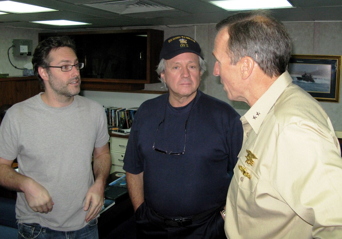 Navy Rear Adm. Joseph D. Kernan, right, commander of U.S. Naval Forces Southern Command and the U.S. 4th Fleet, chats with John Stross, center, owner of Leverock’s Restaurant in St. Petersburg, Fla., and Jason Reed, Walt Disney Studios executive vice president, during the civilian leaders’ visit to Panama to observe Panamax 2008. Defense Dept. photo by Donna Miles