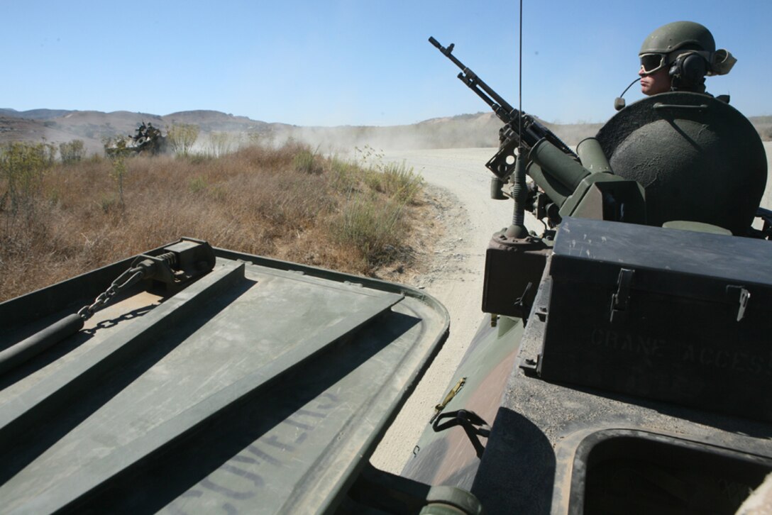 Marines with Light Armored Reconnasaince Platoon, Battalion Landing Team 1/1 conduct surface tactical recovery of aircraft and personnel training here.