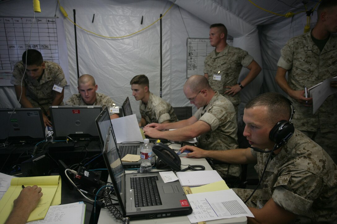 Marines from Company A, 1st Battalion, 7th Marine Regiment participate in the final exercise of the Enhanced Company Operations Limited Objective Experiments 2 at the Combat Center’s Marine Corps Tactics and Operations Group Building Aug. 21. The main focus of the ECO LOE-2 was to train Marines in company level operations due to battlefield missions becoming larger and more distributed.