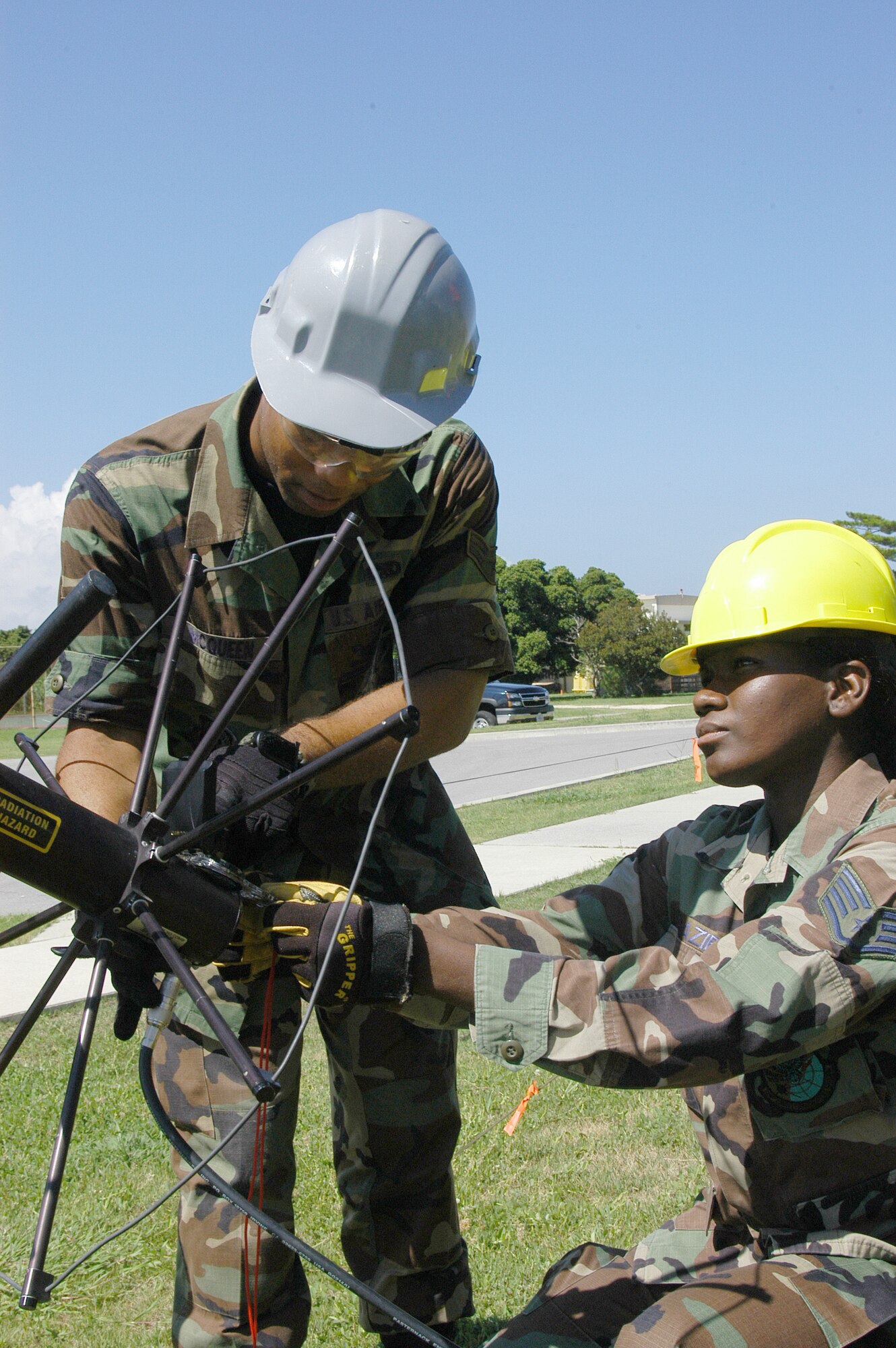 Airman 1st Class David McQueen (left), 353rd Operations Support Squadron, shows Staff Sgt. Consylethia Frazier, 280th Combat Communications Squadron, how to properly line up an AV-2011 antenna assembly during training here Aug. 18. About 70 people from the 28th CBCS, a traditional Air National Guard unit out of Dothan, Ala., traveled here for two weeks of training with the 353rd OSS. 
(U.S. Air Force photo/Tech. Sgt. Aaron Cram)                                                    