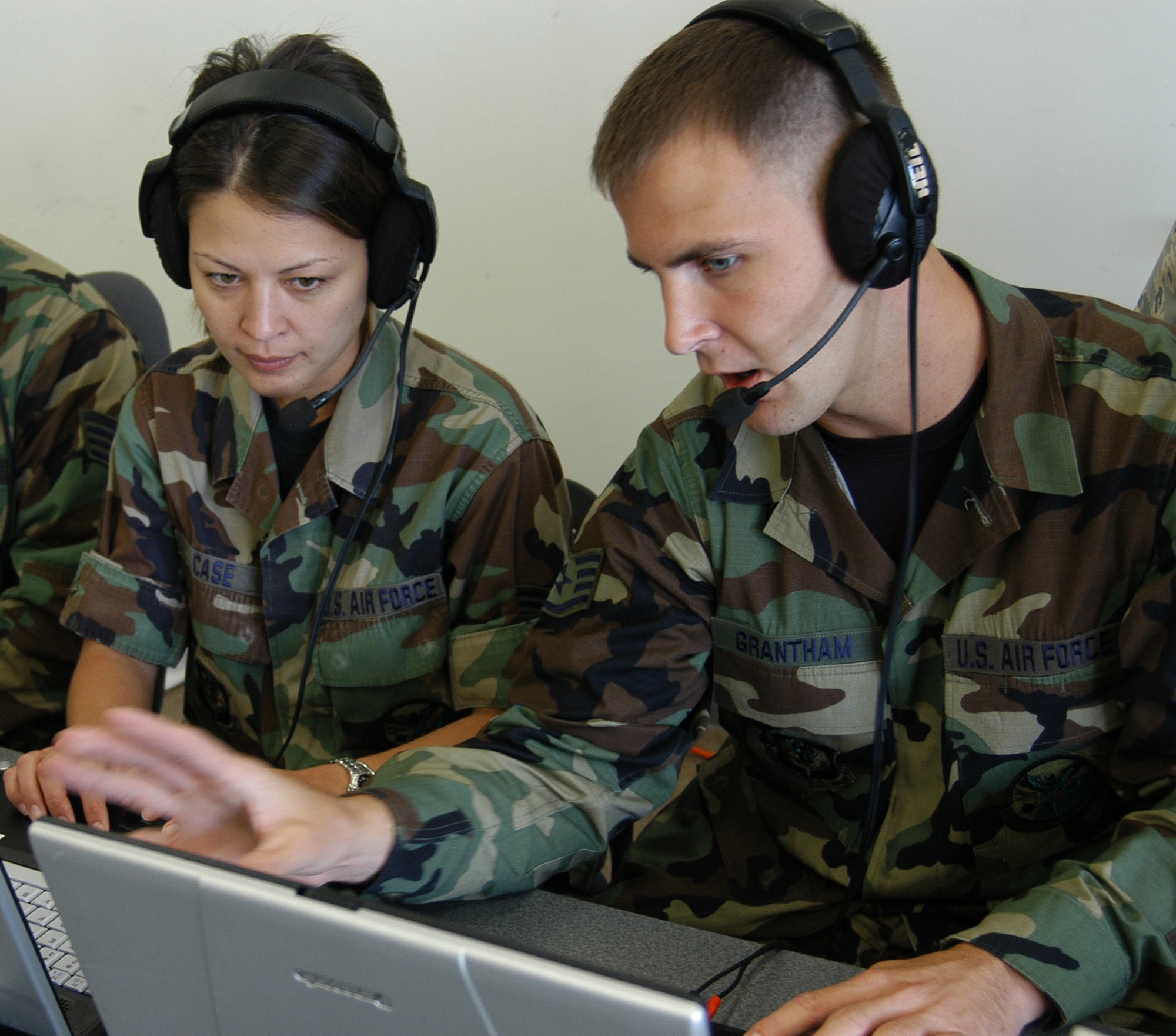 Staff Sgts. Joe Grantham (right) and Jenny Case discuss specifics of the Joint Base Station during some familiarization time after training on the system Aug. 18. The JBS is an all-in-one communications system capable of voice/data communications, local area network and email capabilities. The Guardsmen trained on most of the equipment they would use while deployed to ensure they would be well prepared to support units when tasked. Sergeants Grantham and Case are from the 280th Combat Communications Squadron, a traditional Air National Guard unit out of Dothan, Ala. (U.S. Air Force photo/Tech. Sgt. Aaron Cram) 