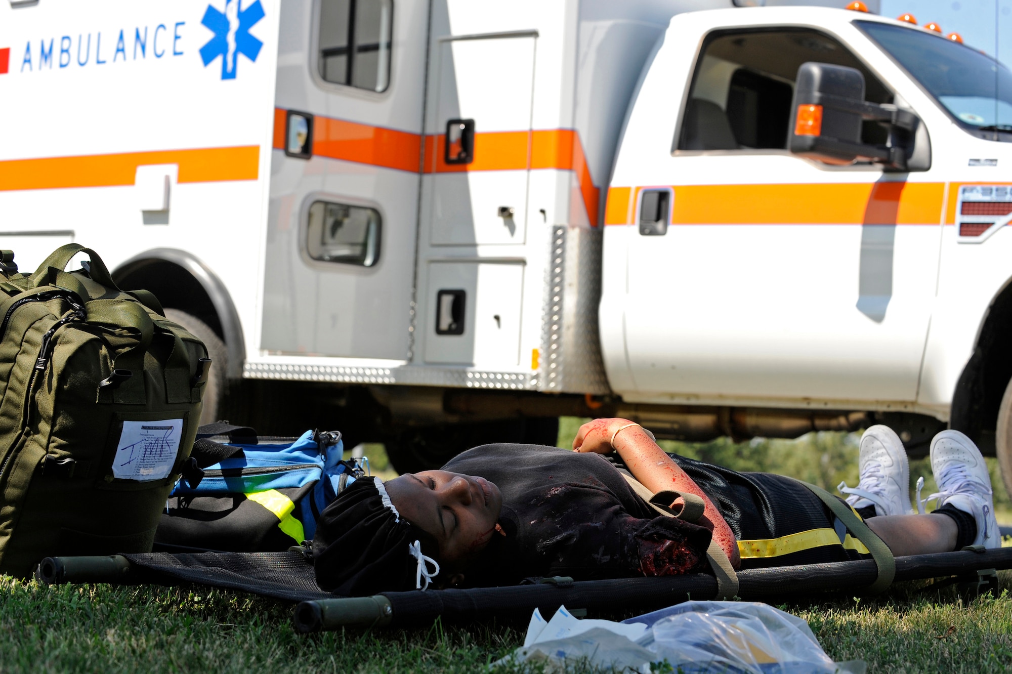 Staff Sgt. Angela Womack, 28th Medical Group health services manager, remains stabilized during a 28 MDG functional exercise here Aug. 21.  The exercise simulated a chemical explosion that originated at the Base Exchange. (U.S. Air Force photo/Airman Matthew Flynn)

