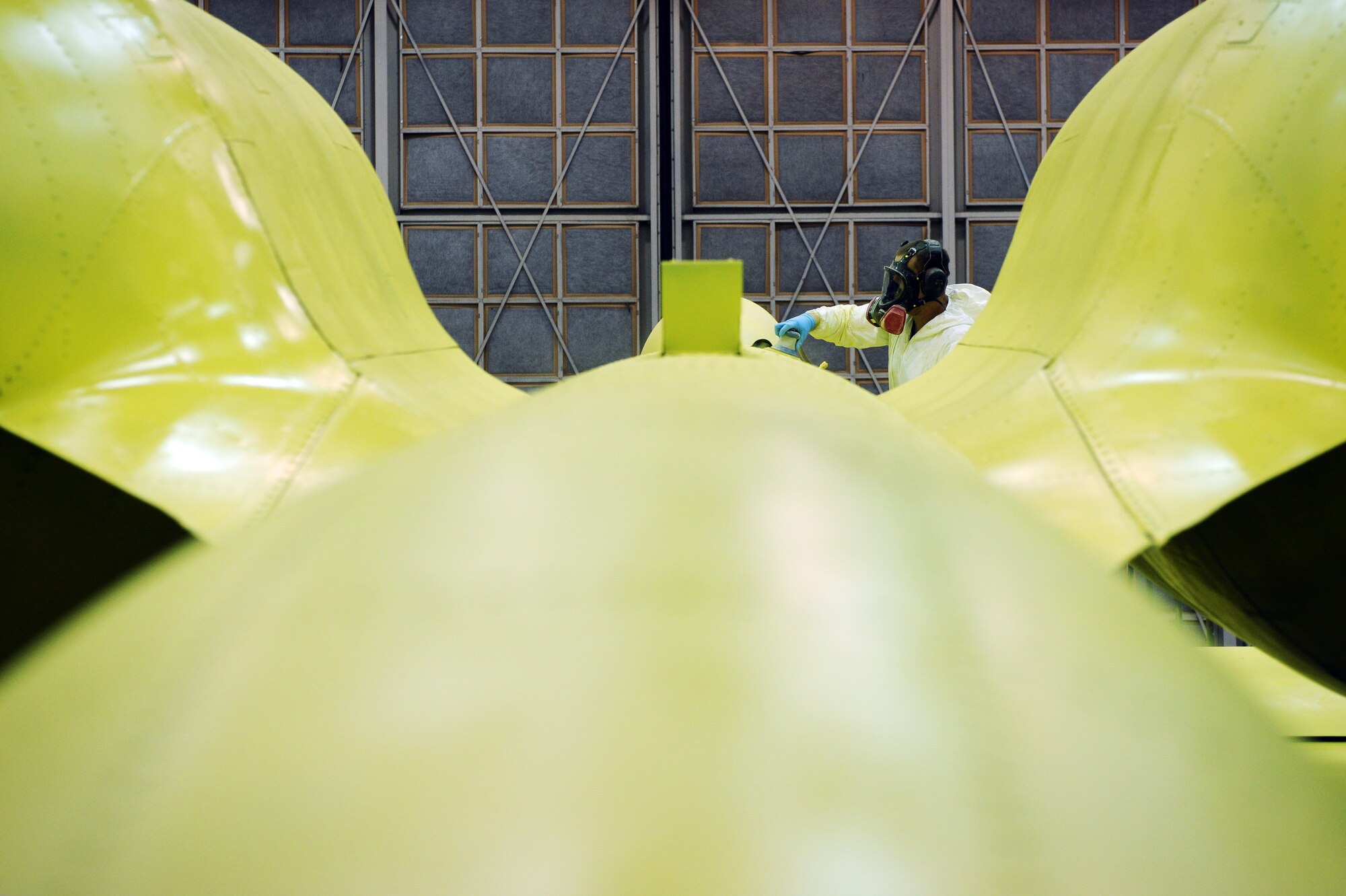 Airman 1st Class Timothy Coulson sands down the primer on an A-10 Thunderbolt II preparing it for its first base coat of paint Aug 20, 2008 at Eielson Air Force Base, Alaska. 354th Maintenance Squadron fabrication shop Airmen are working on restoring an A-10 static display from Heritage Park. This aircraft serves as a reminder of the 355th Fighter Squadron, while stationed here their missions include air strike control, close air support, target interdiction, joint air attack team, combat escort, and combat search and rescue, they were deactivated in 2007.  (U.S. Air Force photo by Airman 1st Class Jonathan Snyder)