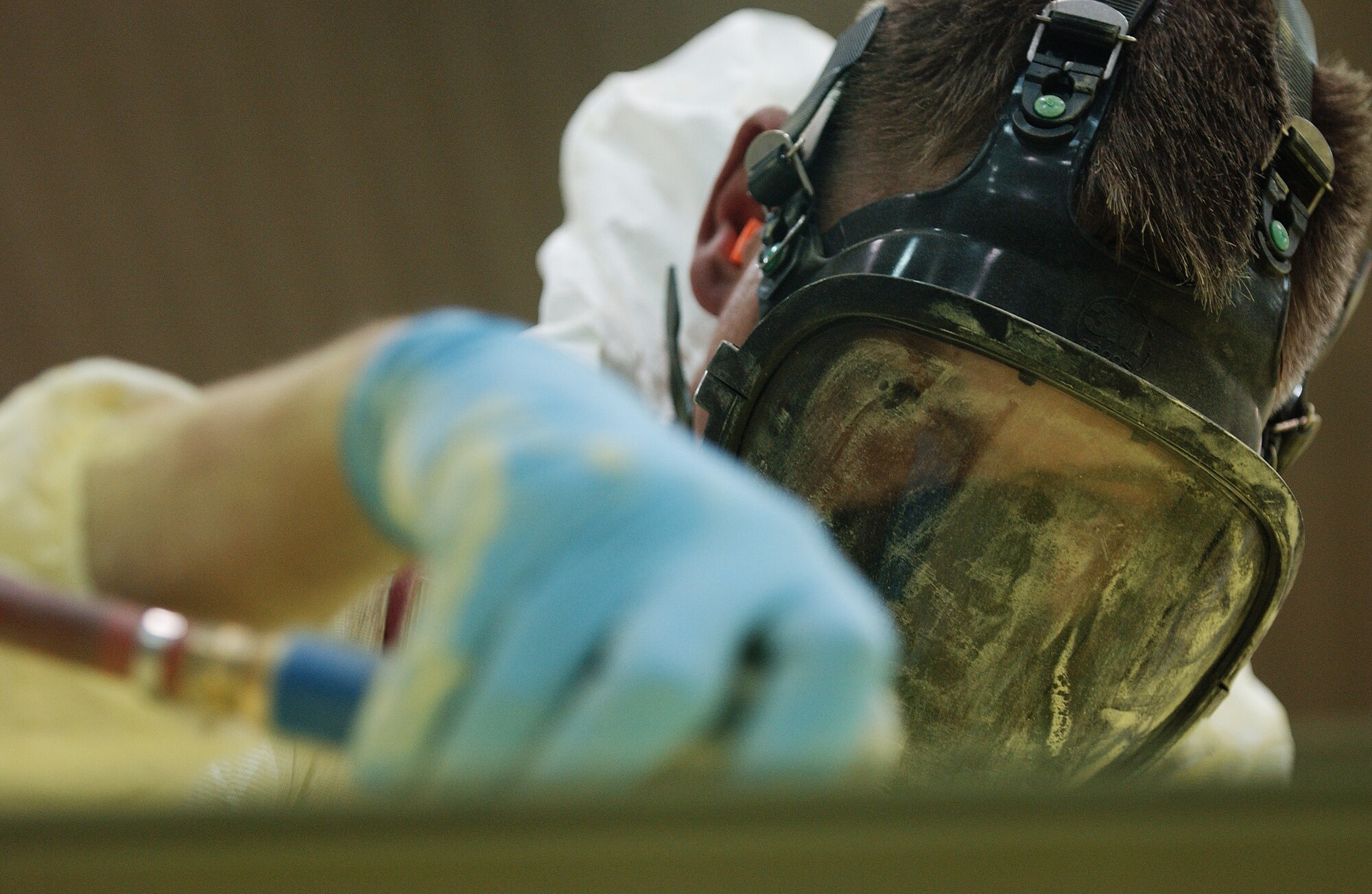 Staff Sgt. Bruce Gappa sands down the primer on an A-10 Thunderbolt II preparing it for its first base coat of paint Aug 20, 2008 at Eielson Air Force Base, Alaska. 354th Maintenance Squadron fabrication shop Airmen are working on restoring an A-10 static display from Heritage Park.  (U.S. Air Force photo by Airman 1st Class Jonathan Snyder)