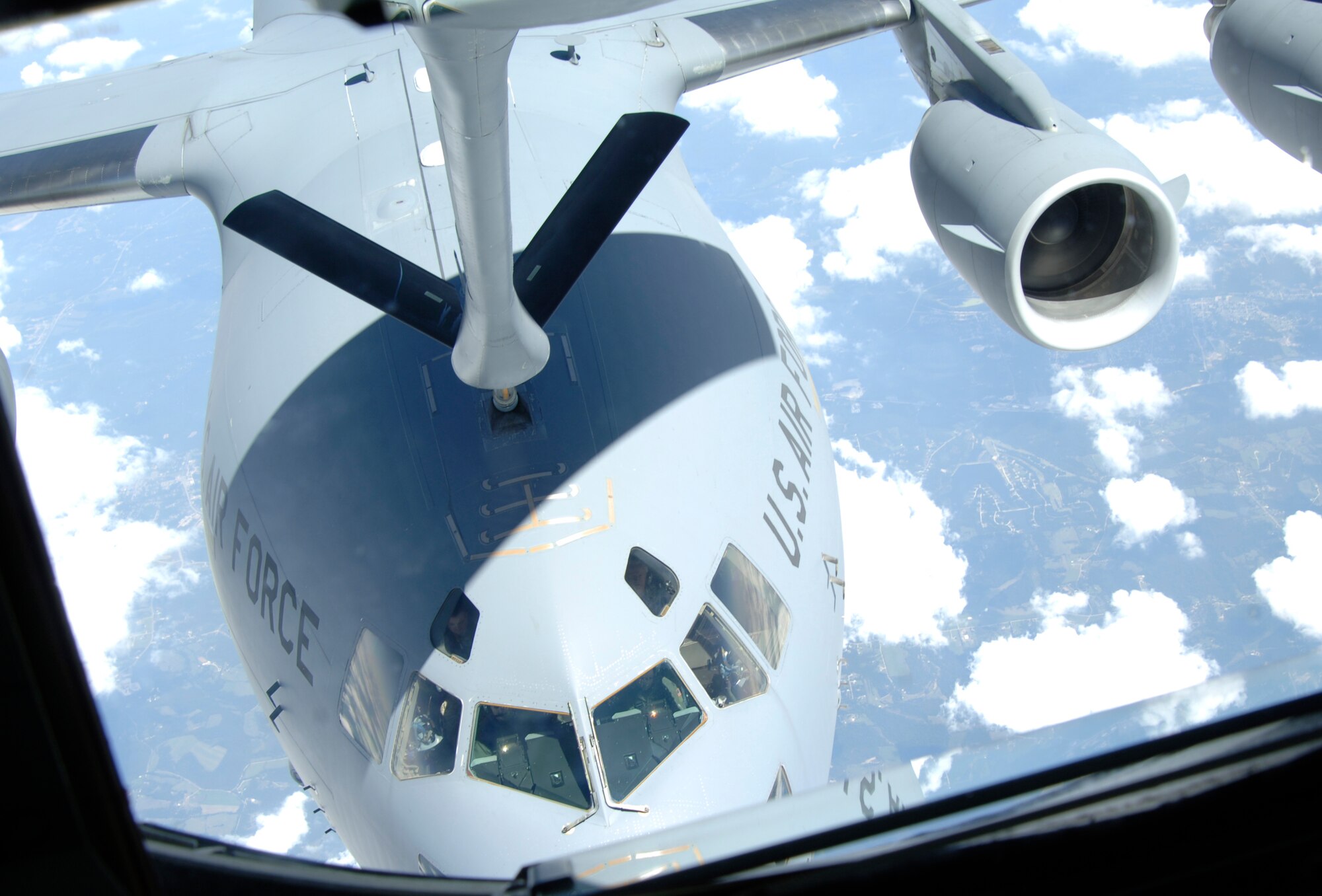 MCCONNELL AIR FORCE BASE, Kan. -- A KC-135 Stratotanker demonstrates an aerial refueling on a C-17 Globemaster III during a civic leader tour, Aug. 18. The tour which included an orientation flight for local civilian leaders, highlighted Air Mobility Command’s and McConnell’s mission and capabilities. (Photo by Senior Airman Roy Lynch III)