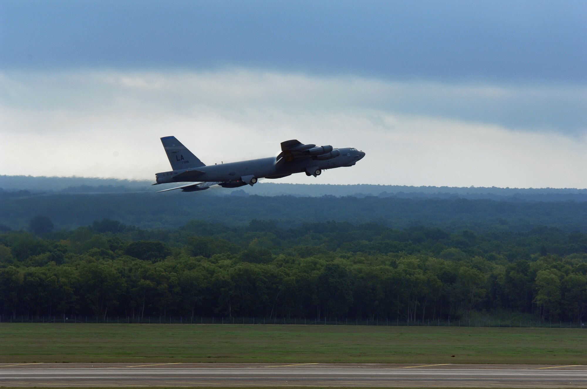 The 2nd Bomb Wing demonstrates runway saturation capability using a minimal interval take off, or MITO, launching 13 B-52s in minimum time, under adverse weather conditions. This is part of their Nuclear Operational Readiness Exercise. (U.S. Air Force photo by Staff Sgt. Trina Jeanjacques) 