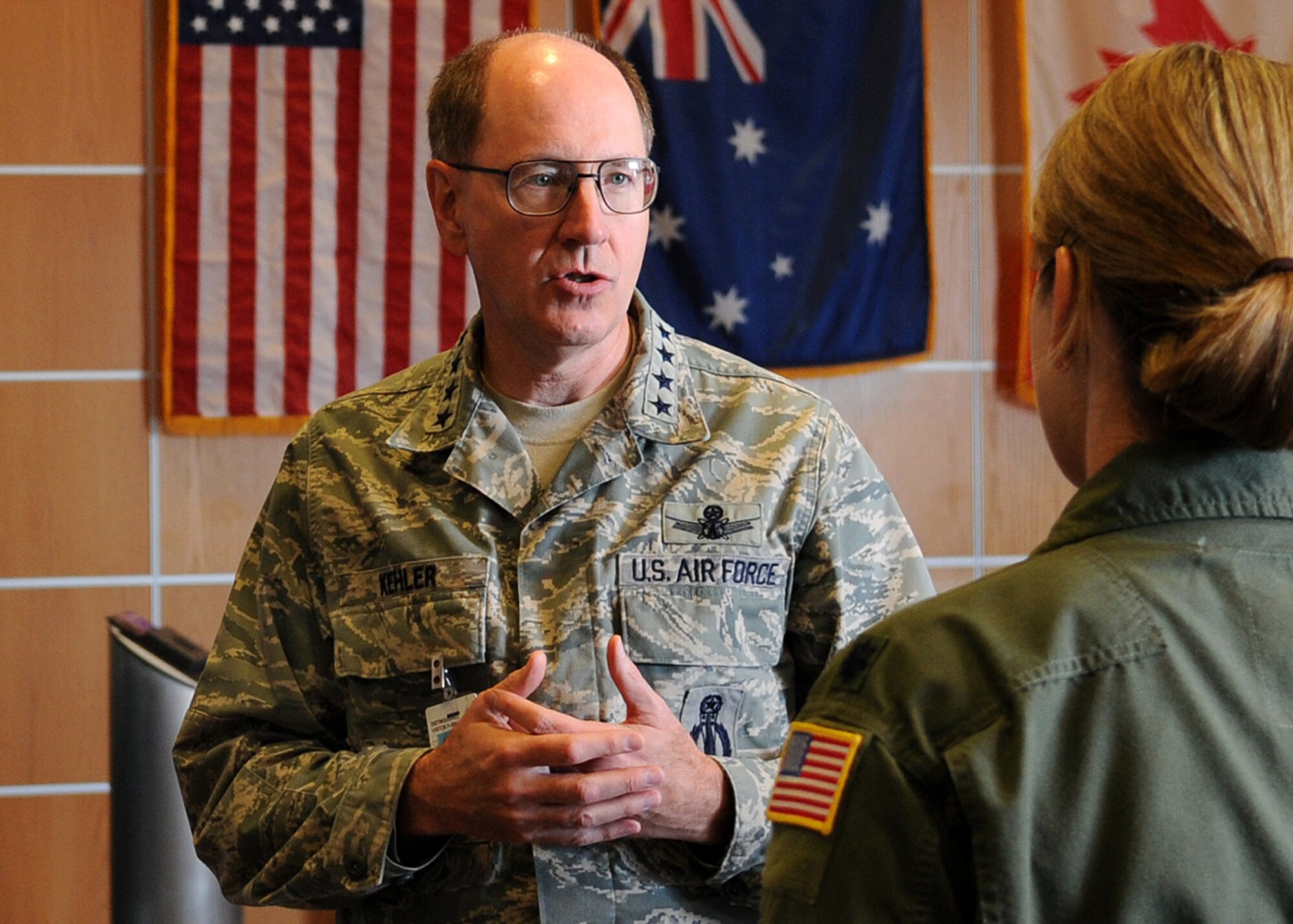 BUCKLEY AIR FORCE BASE, Colo. -- Air Force Space Command Commander, Gen. C. Robert Kehler, speaks with Lt. Col. Michele Edmondson, 2nd Space Warning Squadron commander, in the Mission Control Station lobby here. General Kehler spent Aug. 19 and 20 on the base visiting work centers for the first time since taking command of AFSPC in October 2007. (U.S. Air Force photo by Senior Airman Steven Czyz)