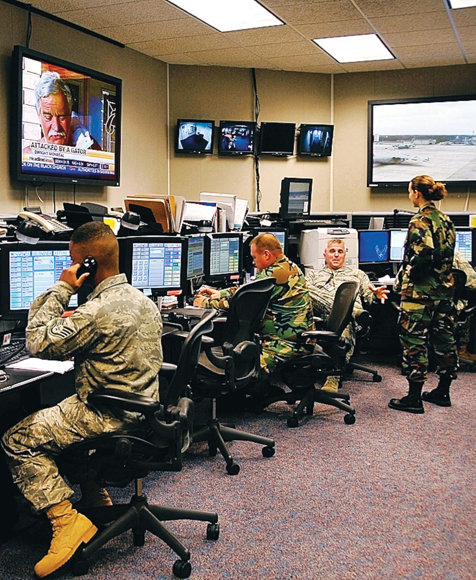 Airmen monitor base activities at the fully-integrated command post monitors in August at Pope. Reservists and active-duty Airmen work side-by-side to execute the command post mission. (U.S. Air Force Photo by Joe Oliva)