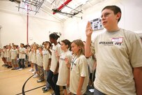 8/14/2008 - The new "Airmen" swear in before their half-day deployment Aug. 14. This year, 152 Team Lackland children participated in Operation JET, learning about the deployment process and getting some insight into what their parents go through. (USAF photo by Robbin Cresswell)