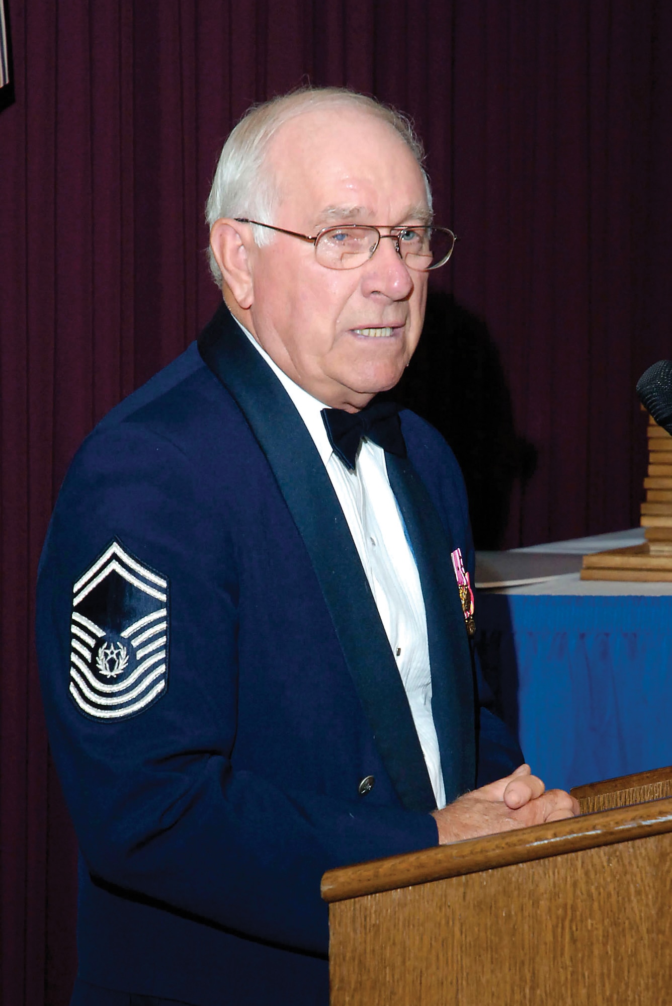 Retired Chief Master Sgt. of the Air Force Sam Parish congratulates those recognized during the senior non-commissioned officer inductee banquet Aug. 15 at the Tinker Club.  Sergeant Parish was promoted to the leadership role in 1983 and retired from active duty in 1986.(Air Force photo/Dave Faytinger)
