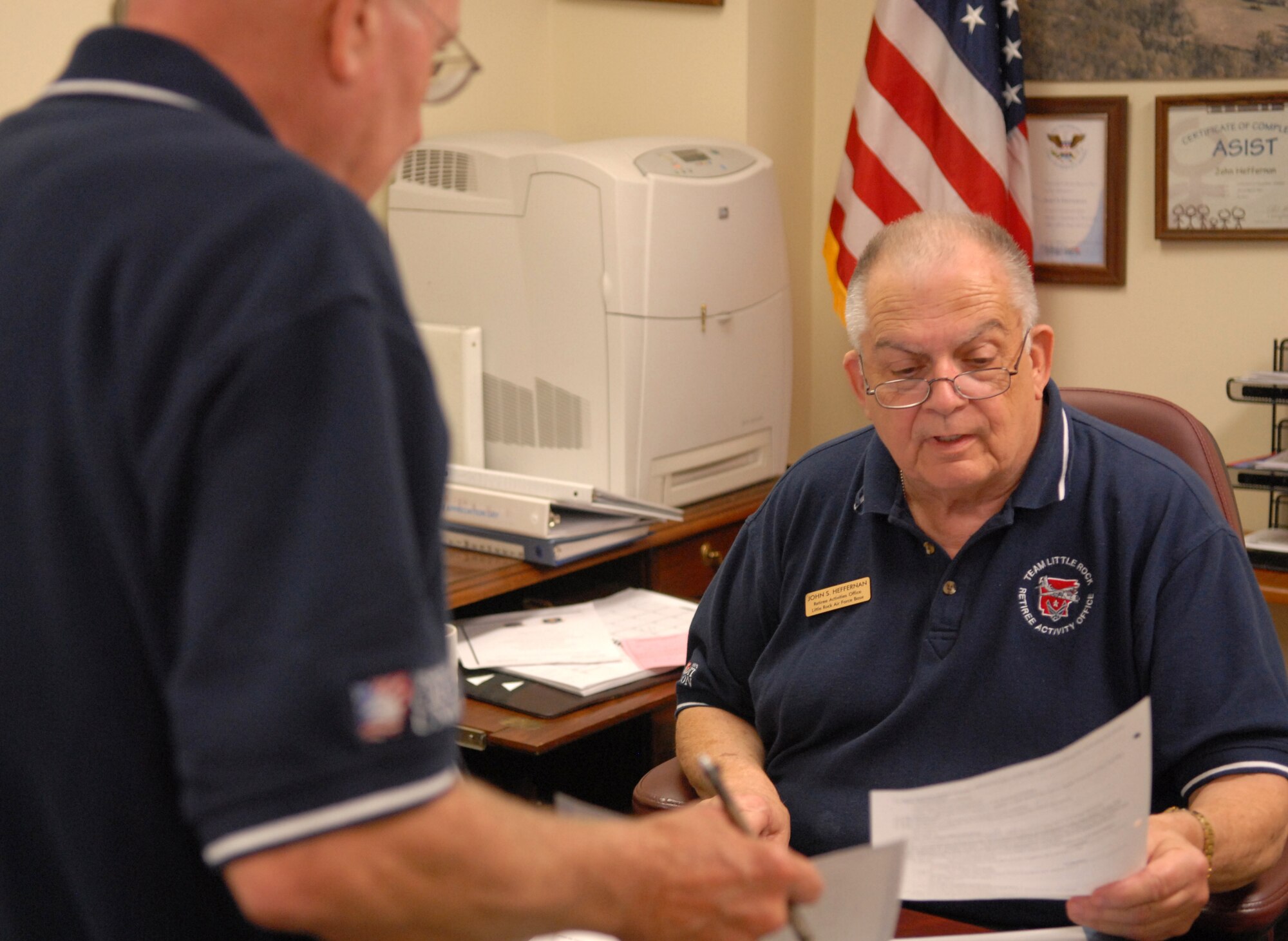 John Heffernan, Little Rock Air Force Base Retiree Activities Office director, reviews paperwork at the Retiree Activities Office. The RAO services all military retirees, surviving spouses of retired and active duty personnel and all military members about to retire. (U.S. Air Force photo by Senior Airman Chris Willis)