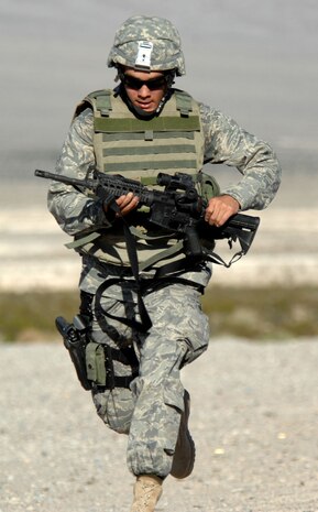 Airman Sean Young, 99th Security Forces Squadron, hustles to his next obstacle during run and shoot training near Creech Air Force Base, Nev. Aug. 11, 2008. The run and shoot training is part of the 99th Ground Combat Training Squadron's Joint Base Balad training curriculum, a new forty-five day training course designed for security forces personnel and chaplains to train to embed with the Army stationed there, and eventually take over all Army operations outside the wire at Joint Base Balad, Iraq.
(U.S. Air Force Photo/Senior Airman Larry E. Reid Jr.)
