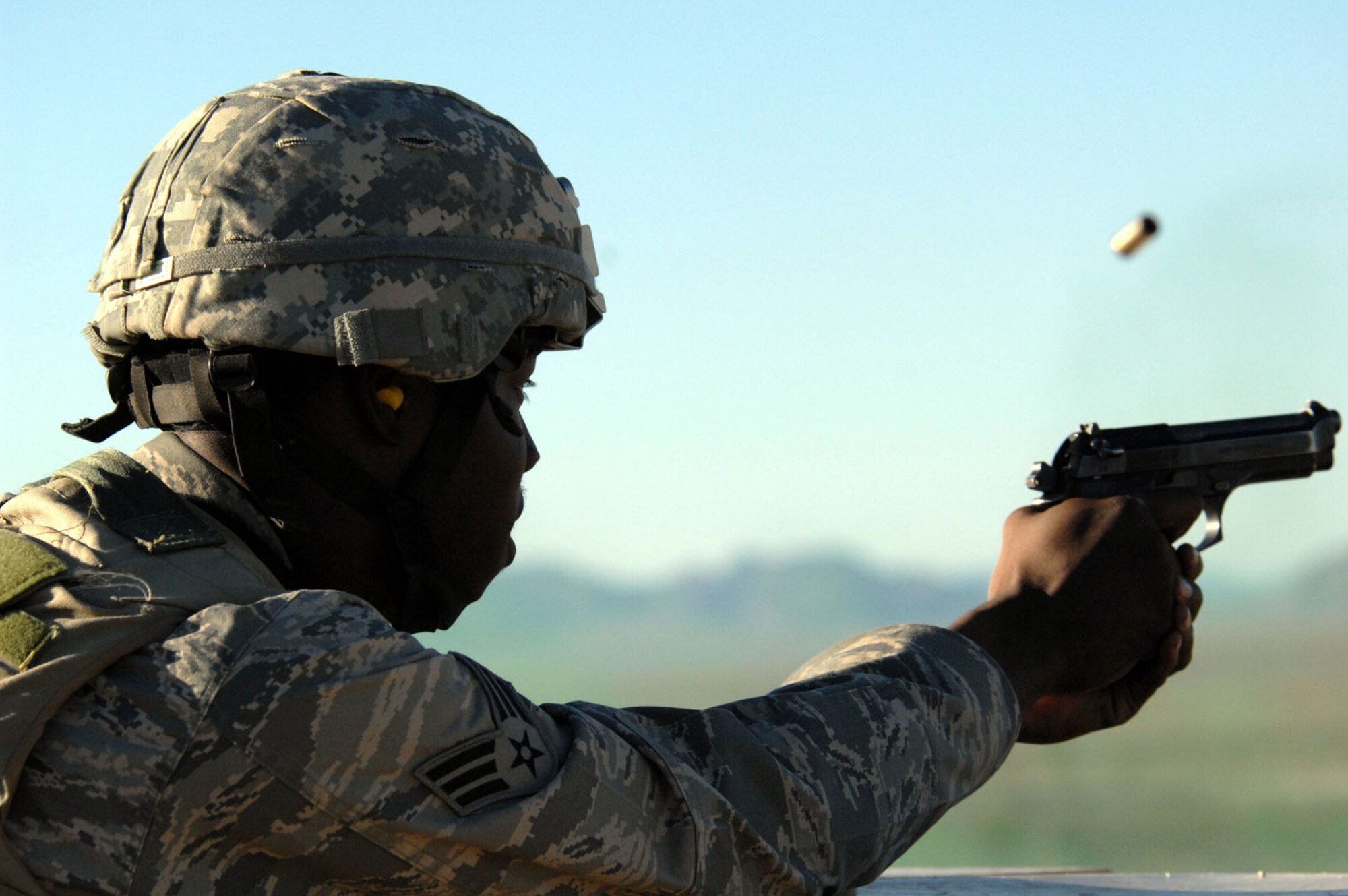 Senior Airman Joseph Steel, 99th Security Forces Squadron, trains on the M-9 during target practice on the firing range near Creech Air Force Base, Nev. Aug. 11, 2008. The 99th Ground Combat Training Squadron recently began a new forty-five day training course called Joint Base Balad, which is designed for security forces personnel and chaplains to train to embed with the Army stationed there, and eventually take over all Army operations outside the wire at Joint Base Balad, Iraq.
(U.S. Air Force Photo/Senior Airman Larry E. Reid Jr.)
