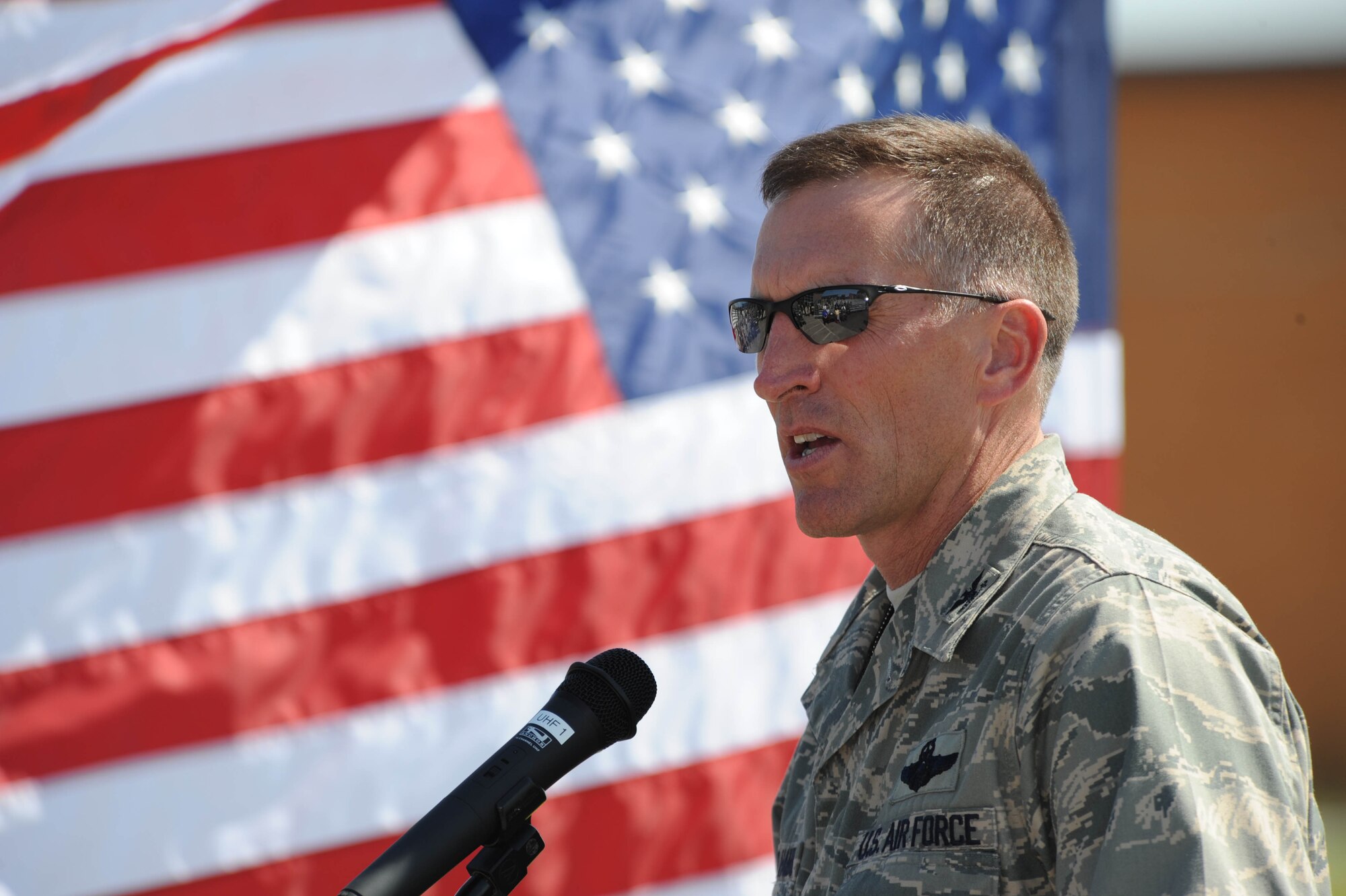 Col. Scott Vander Hamm, 28th Bomb Wing commander, speaks at the Radar Approach Control Ribbon Cutting event here, Aug. 20. The ribbon cutting signifies a new facility opening for usage of radar air traffic services that will aid controllers by eliminating ground clutter and displaying multiple levels of precipitation. (U.S. Air Force photo/Airman Corey Hook)