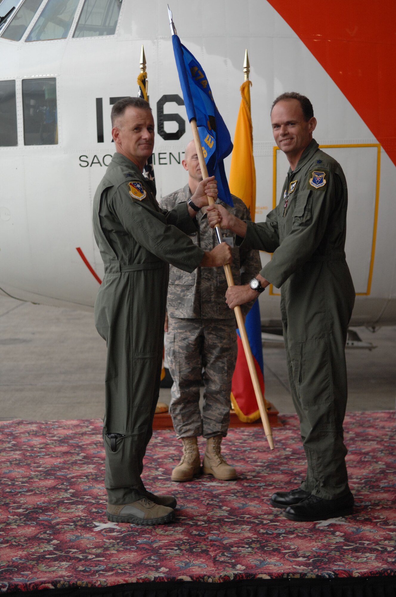 Lt. Col. Robert Leonard formally relinquishes command of the 478th Expeditionary Operations Squadron, Forward Location Manta, Ecuador, to Colonel Douglas Galipeau, 474th Air Expeditionary Group commander, during a change of command ceremony here August 20. Since Lt. Col. Leonard assumed command in August 2007, approximately 940 counterdrug missions were launched from the FOL. This
enabled the Joint Interagency Task Force South and partner nations to disrupt or seize illegal drugs valued at approximately $4.12 billion during that time. (U.S. Air Force Photo/1Lt. Lauren Wright)