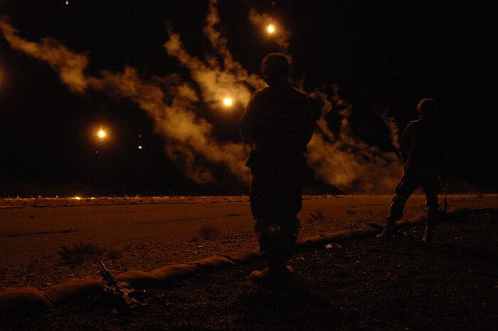 Trainees set off flares during night training on the firing range near Creech Air Force Base, Nev. Aug. 11, 2008. The 99th Ground Combat Training Squadron recently began a new forty-five day training course called Joint Base Balad, which is designed for security forces personnel and chaplains to train to embed with the Army stationed there, and eventually take over all Army operations outside the wire at Joint Base Balad, Iraq.
(U.S. Air Force Photo/Senior Airman Larry E. Reid Jr.,)