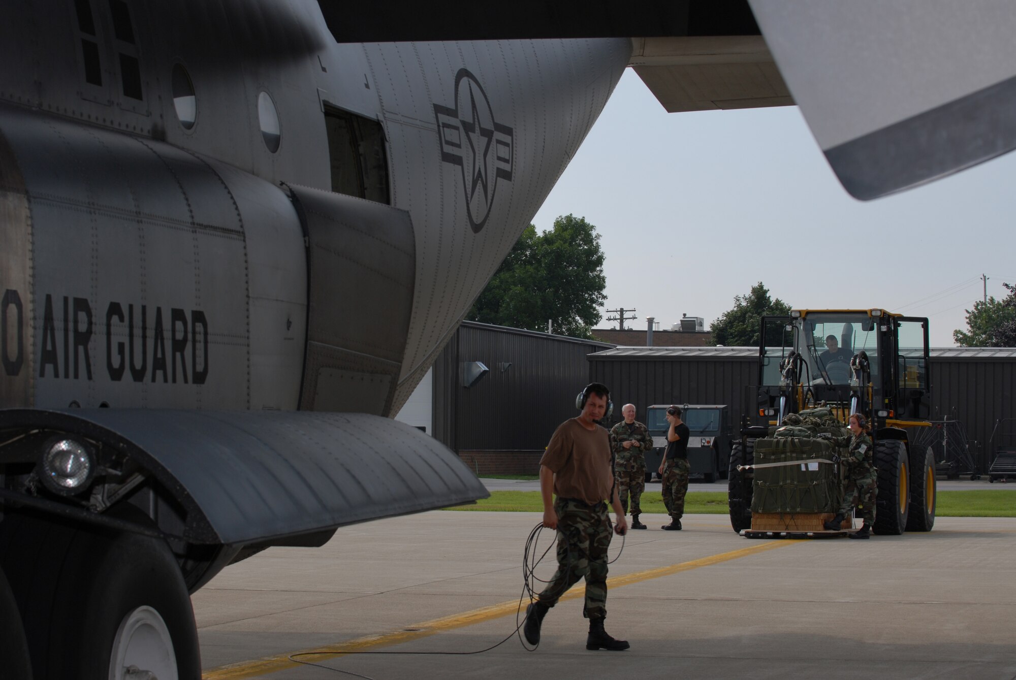 Members of the 179th Ariel Port Squadron load cargo into C-130 aircraft at Mansfield Lahm Airport, Mansfield, Ohio on July 9, 2008. The Ariel Port Airman are supporting an Air Rodeo competition where pilots display their skills in air drops and landing precision. (Air Force photo by Staff Sgt Robert Koehler) (Released)