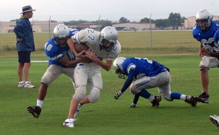 Randolph High School Ro-Hawk football team members practice Aug. 18 for their upcoming season. The Ro-Hawks will open their season Aug. 29 at Marion High School. (U.S. Air Force photo by Rich McFadden)