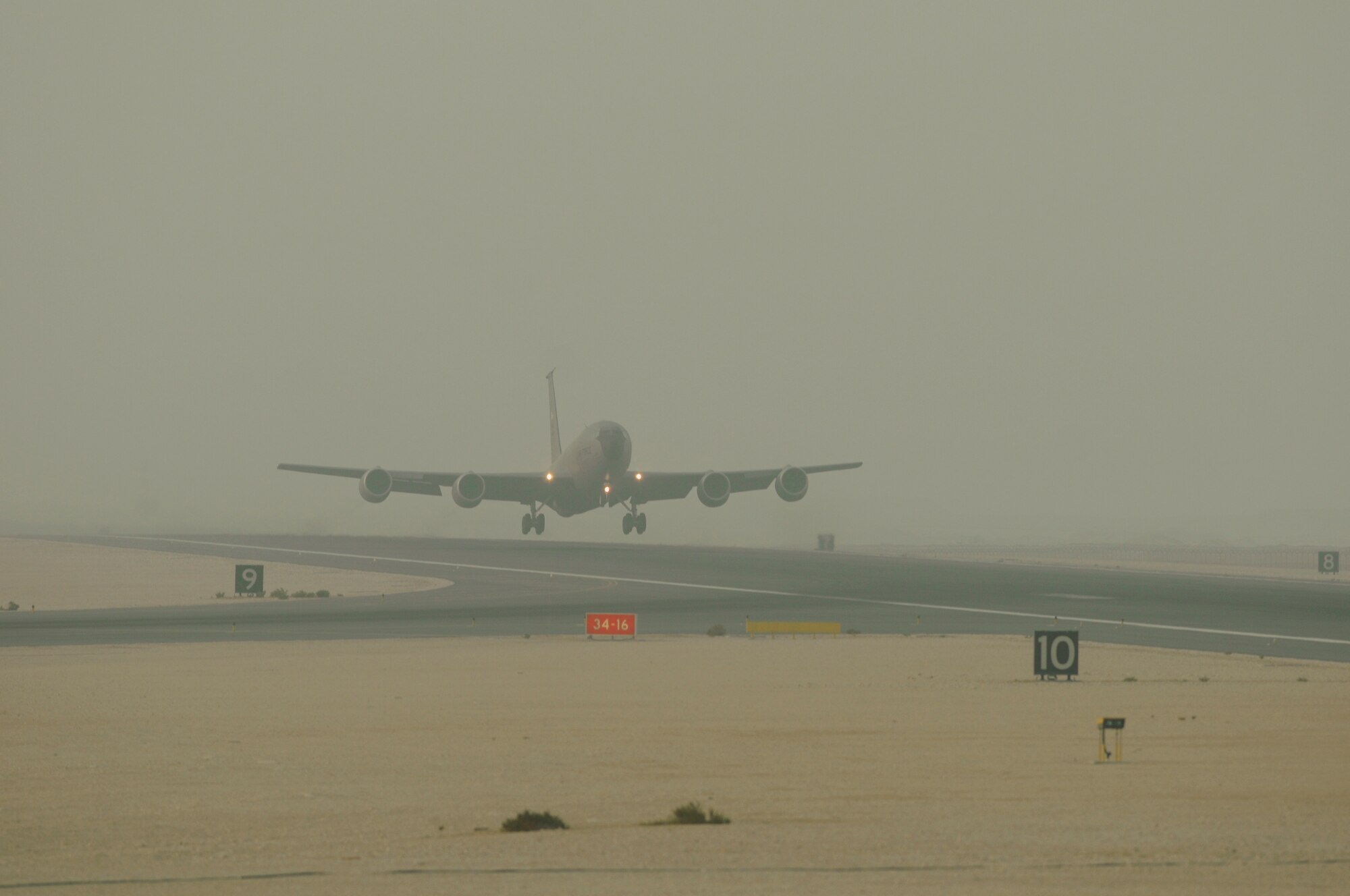 A KC-135 from the 379th Expeditionary Operations Group, 340th Expeditionary Air Refueling Squadron, takes off through morning fog at an undisclosed air base Aug. 19, 2008. The KC-135 refuelers provide aerial refueling support to Air Force, Navy and Marine Corps and allied nation aircraft engaged in Operations Iraqi Freedom, Enduring Freedom and Joint Task Force-Horn of Africa.  (U.S. Air Force photo by Tech. Sgt. Michael Boquette/Released)