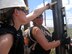 Senior Airman Elizabeth Humphrey (foreground) and Senior Master Sgt. Carol Davis check the alignment of a fence post being set. (Chief Master Sgt. Steve Peters/KyANG)