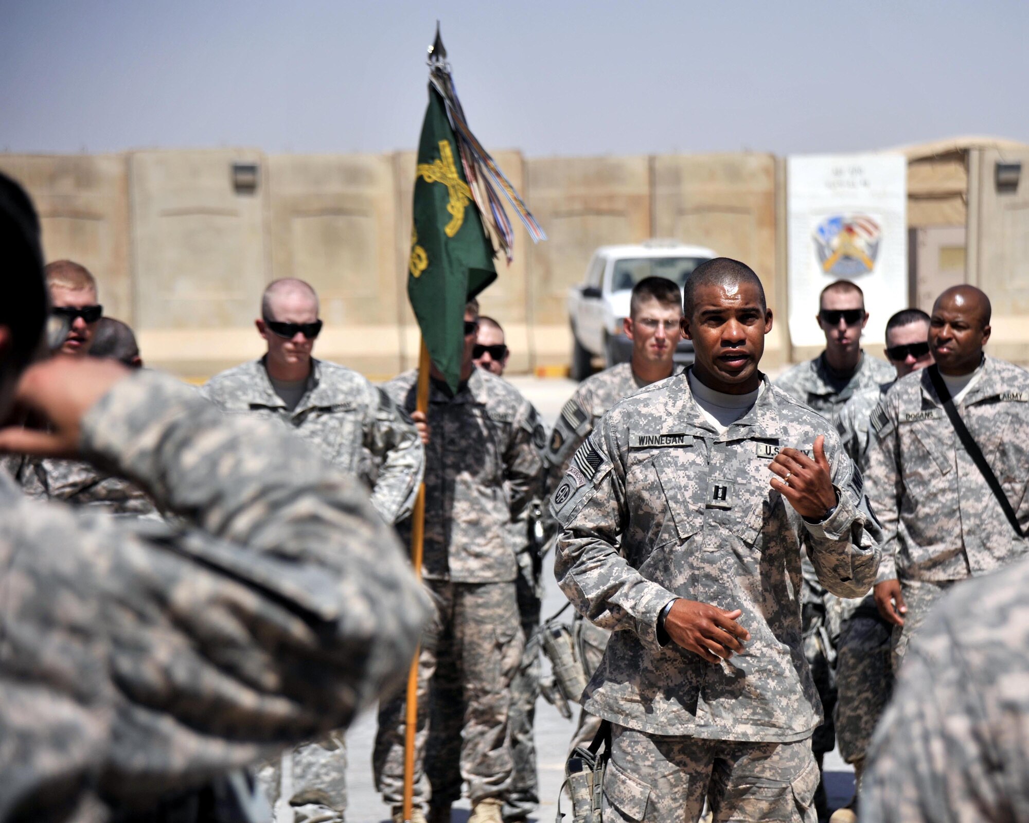 8/14/2008 - SATHER AIR BASE, Iraq - Army Capt. Barry Winnegan, 978th Military Police Company commander, gives words of comfort, encouragement and praise to his Soldiers as they gathered to provide patriot honors for fellow Soldier Cpl. James Hale, who was killed July 13 in Baghdad by a roadside bomb.  The patriot ceremony marks the beginning of the journey home for U.S. service members killed while serving in deployed locations. (U.S. Air Force Photo by Master Sgt. Brian Davidson) 