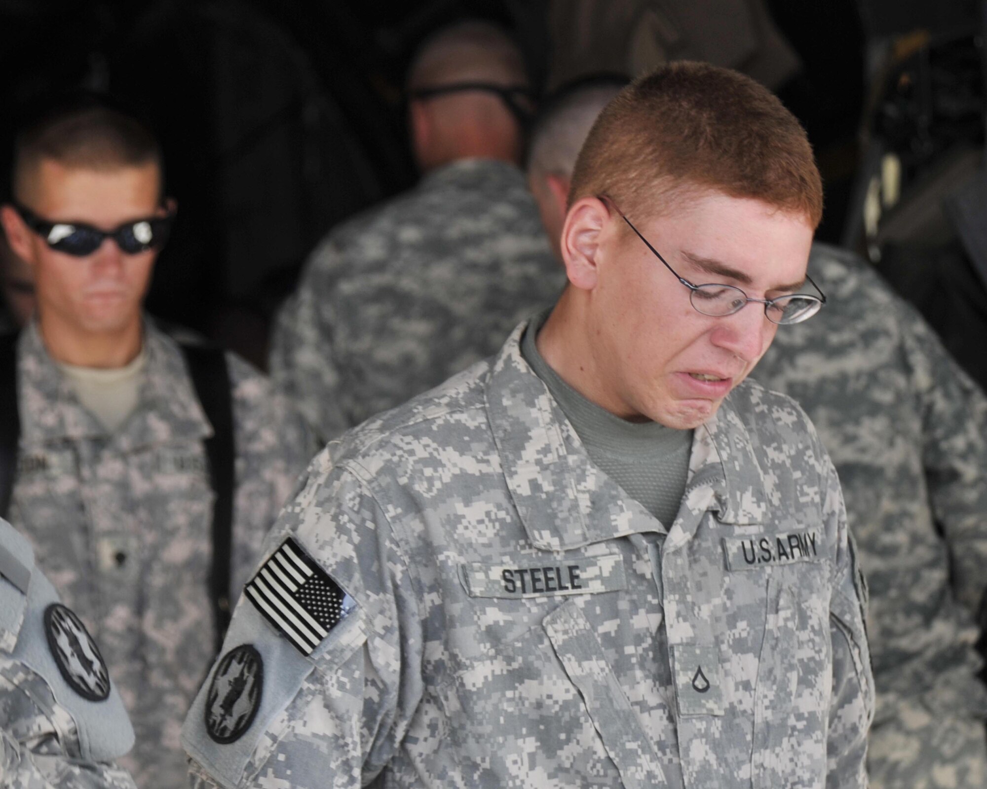 8/14/2008 - SATHER AIR BASE, Iraq ? Private 1st Class Derek Steele, a Soldier with the 978th Military Police Company, leaves the aircraft that carried the body of fellow Soldier and friend Cpl. James Hale home from Iraq. Soldiers from the 978th MP Company and Airmen from the 447th Air Expeditionary Group gathered to provide patriot honors to Corporal Hale, who was killed July 13 in Baghdad by a roadside bomb.  The patriot ceremony marks the beginning of the journey home for U.S. service members killed while serving in deployed locations. (U.S. Air Force Photo by Master Sgt. Brian Davidson)Soldiers from the 978th MP Company and Airmen from the 447th Air Expeditionary Group gathered to provide patriot honors to Corporal Hale, who was killed July 13 in Baghdad by a roadside bomb.  The patriot ceremony marks the beginning of the journey home for U.S. service members killed while serving in deployed locations. (U.S. Air Force Photo by Master Sgt. Brian Davidson)