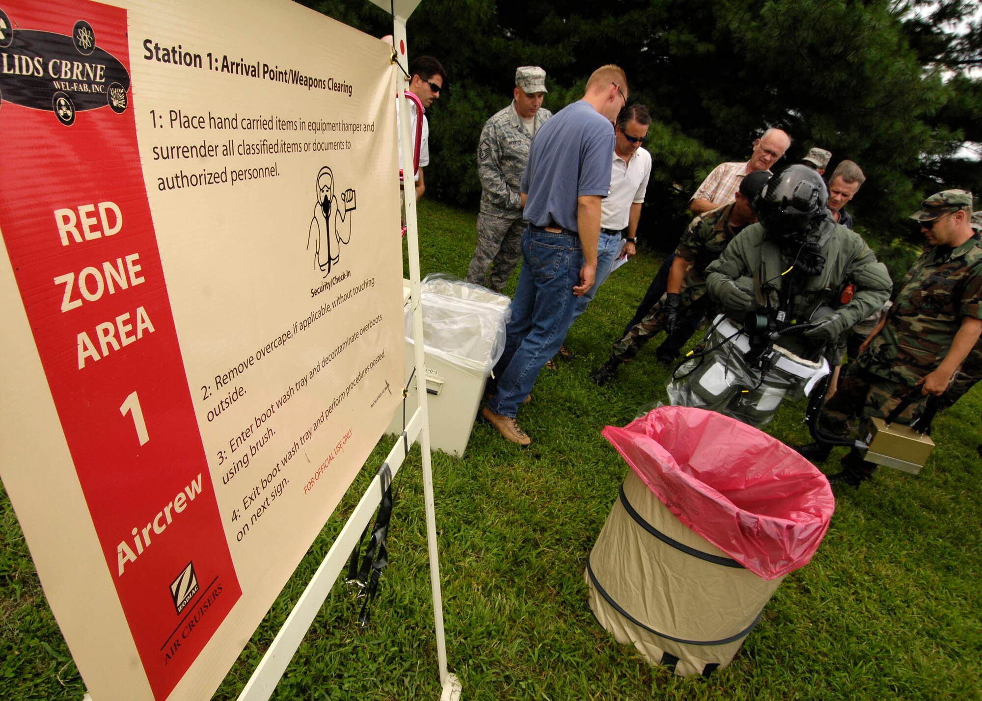 SCOTT AIR FORCE BASE, Ill. -- U.S. Navy Lieutenant Tony Wilson, joint strike fighter test pilot, packs River Maryland as he undergoes the decontamination process to test new equipment designed to better protect the body in case of chemical warfare. 
(US Air Force photo/Senior Airman Mildred Guevara)
