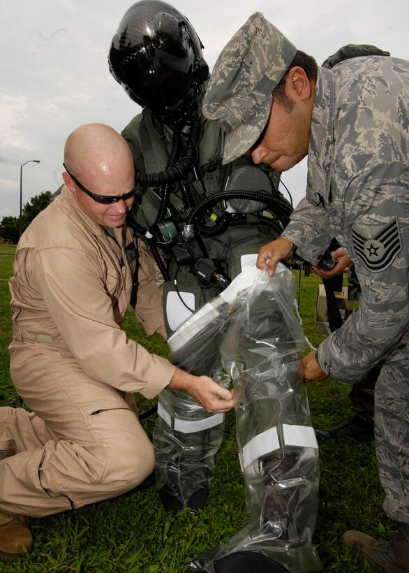 SCOTT AIR FORCE BASE, Ill. -- U.S. Navy Lieutenant Tony Wilson, joint strike fighter test pilot, packs River Maryland as he undergoes the decontamination process to test new equipment designed to better protect the body in case of chemical warfare. 
(US Air Force photo/Senior Airman Mildred Guevara)
